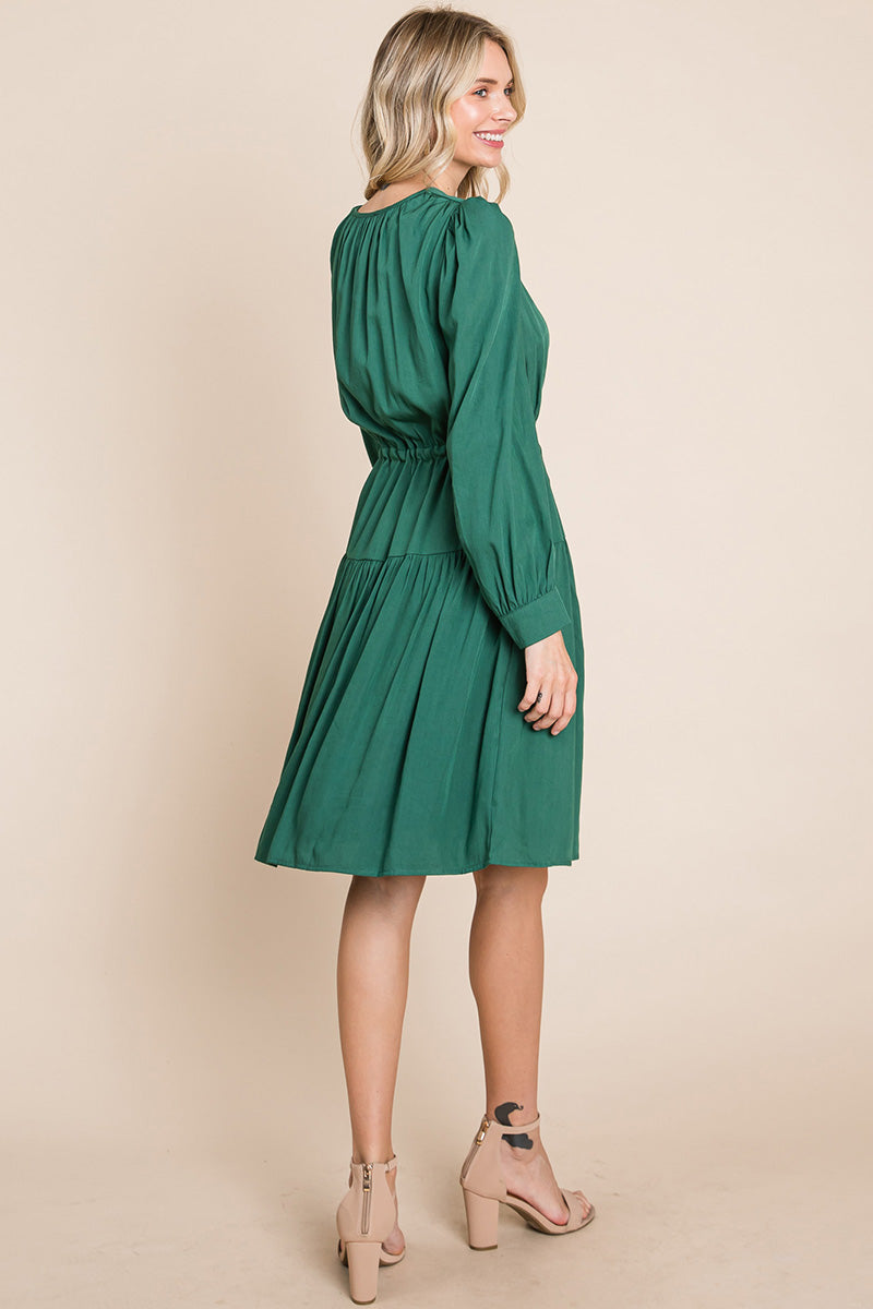 A stylish Long Sleeve Tiered Waist String Ruched Dress featuring a V-neck, long sleeves, and a tiered waist design, perfect for various occasions.