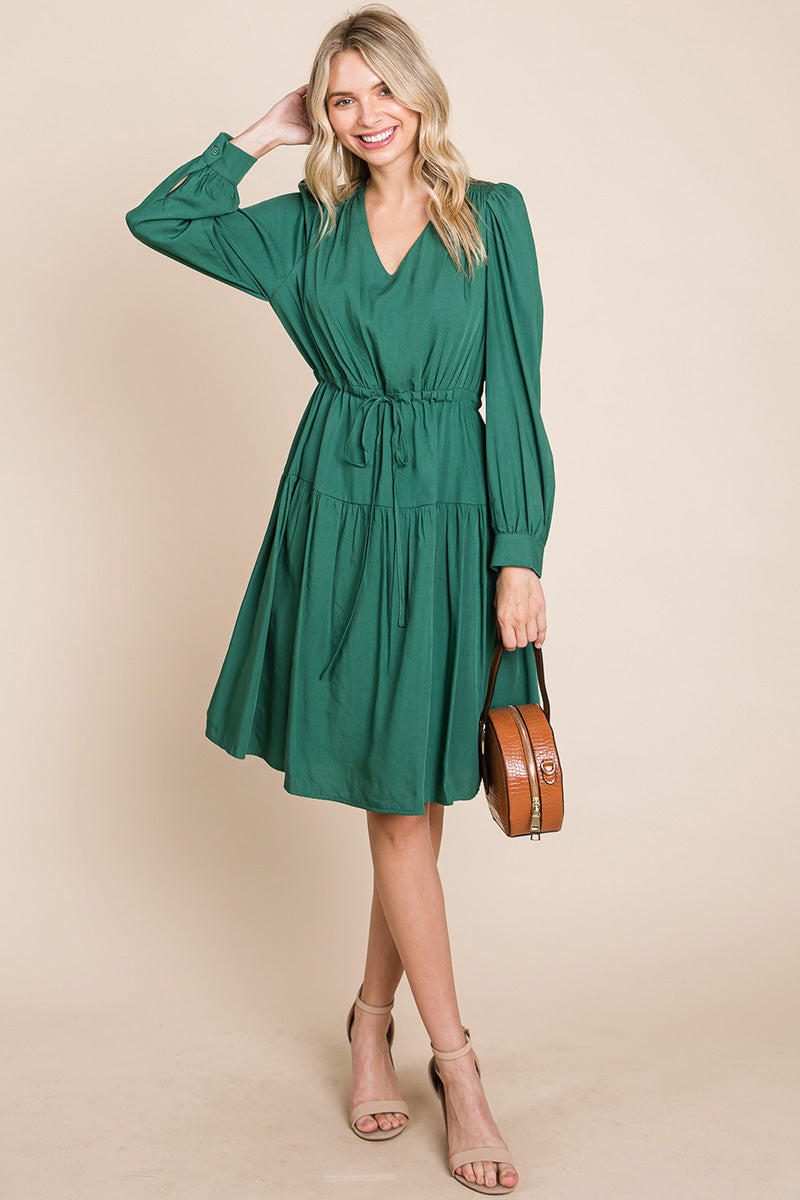 A stylish Long Sleeve Tiered Waist String Ruched Dress featuring a V-neck, long sleeves, and a tiered waist design, perfect for various occasions.