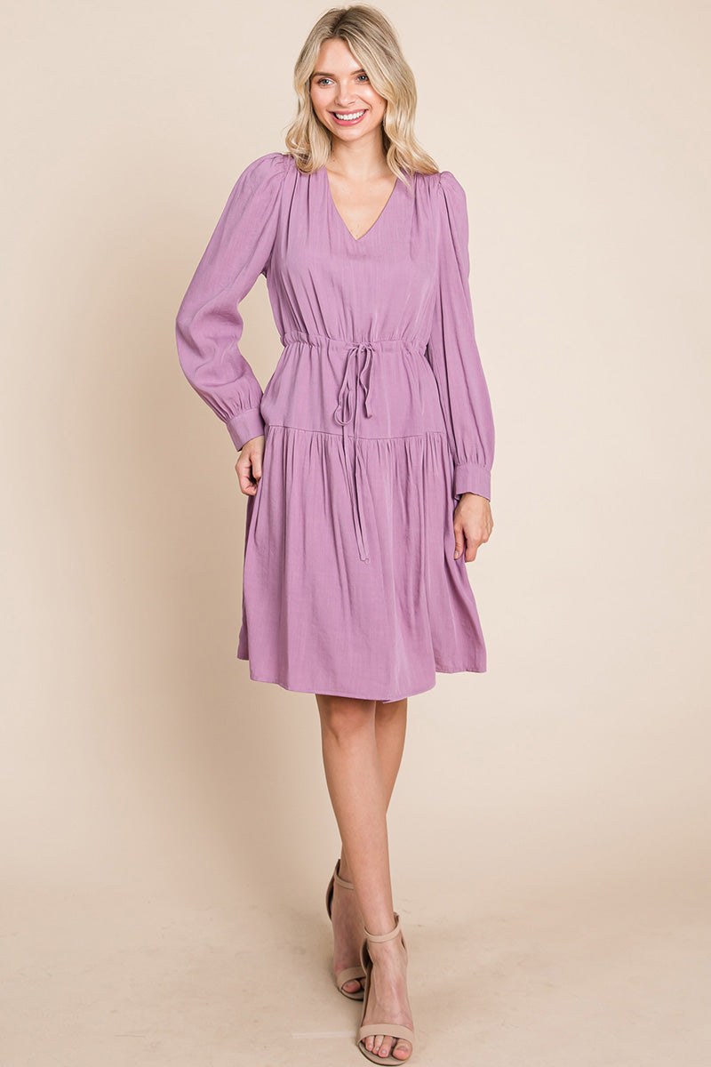 A stylish Long Sleeve Tiered Waist String Ruched Dress featuring a V-neck, long sleeves, and a tiered waist design, perfect for various occasions.