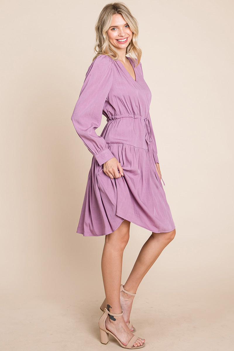 A stylish Long Sleeve Tiered Waist String Ruched Dress featuring a V-neck, long sleeves, and a tiered waist design, perfect for various occasions.