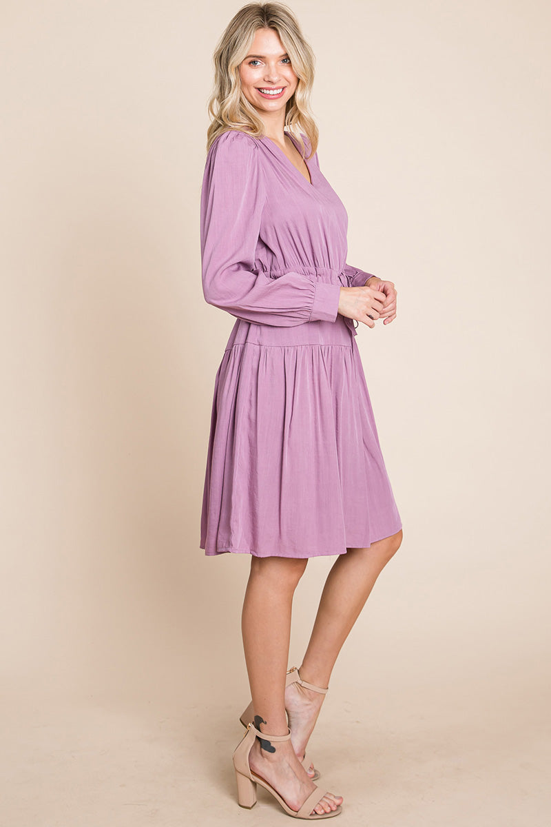 A stylish Long Sleeve Tiered Waist String Ruched Dress featuring a V-neck, long sleeves, and a tiered waist design, perfect for various occasions.