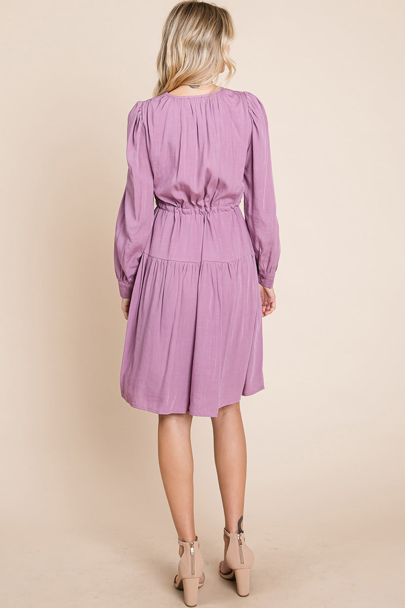 A stylish Long Sleeve Tiered Waist String Ruched Dress featuring a V-neck, long sleeves, and a tiered waist design, perfect for various occasions.