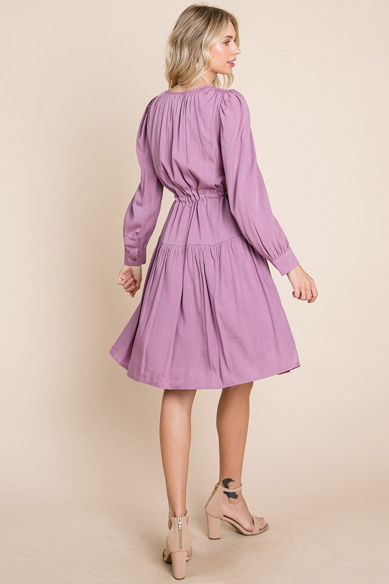 A stylish Long Sleeve Tiered Waist String Ruched Dress featuring a V-neck, long sleeves, and a tiered waist design, perfect for various occasions.