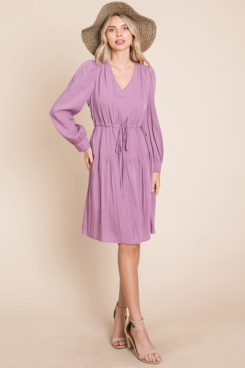 A stylish Long Sleeve Tiered Waist String Ruched Dress featuring a V-neck, long sleeves, and a tiered waist design, perfect for various occasions.