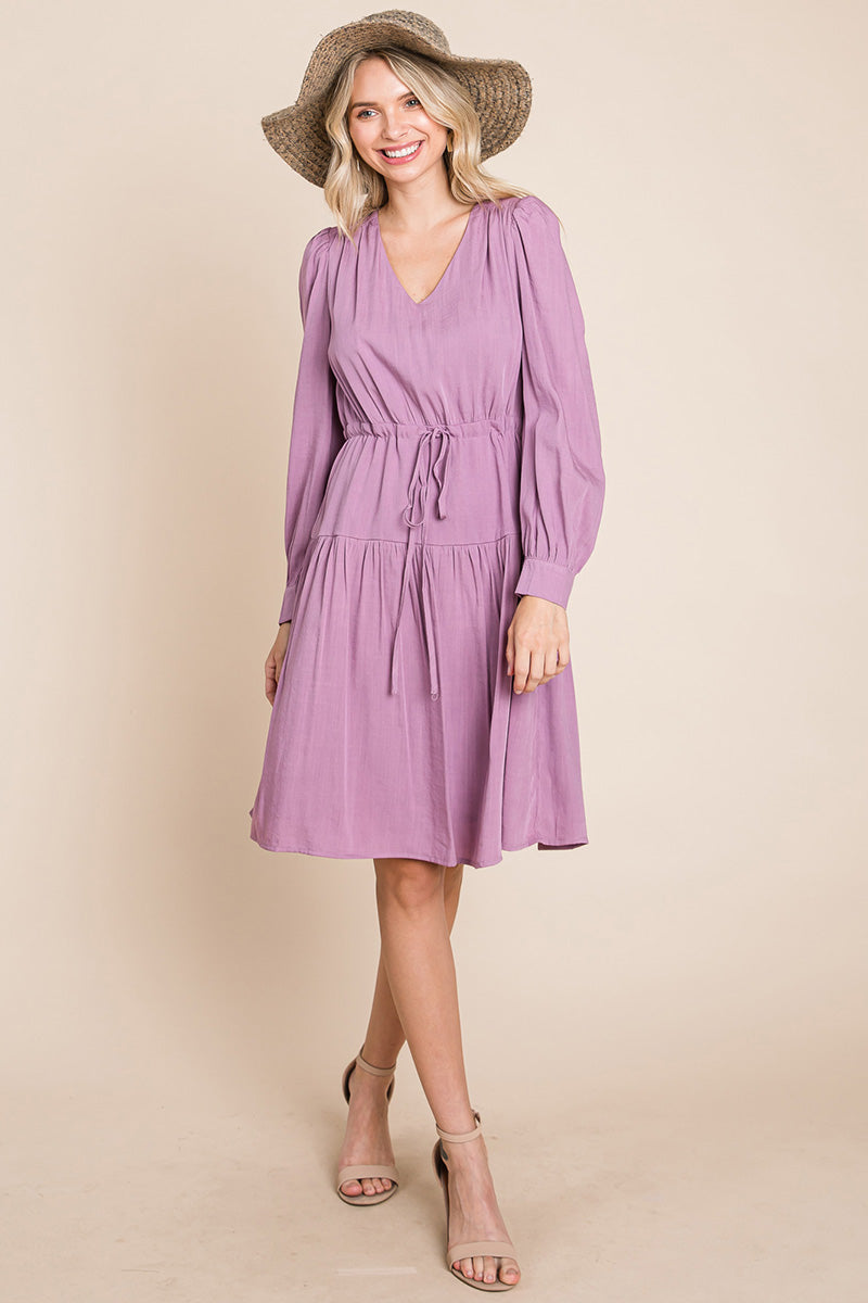 A stylish Long Sleeve Tiered Waist String Ruched Dress featuring a V-neck, long sleeves, and a tiered waist design, perfect for various occasions.