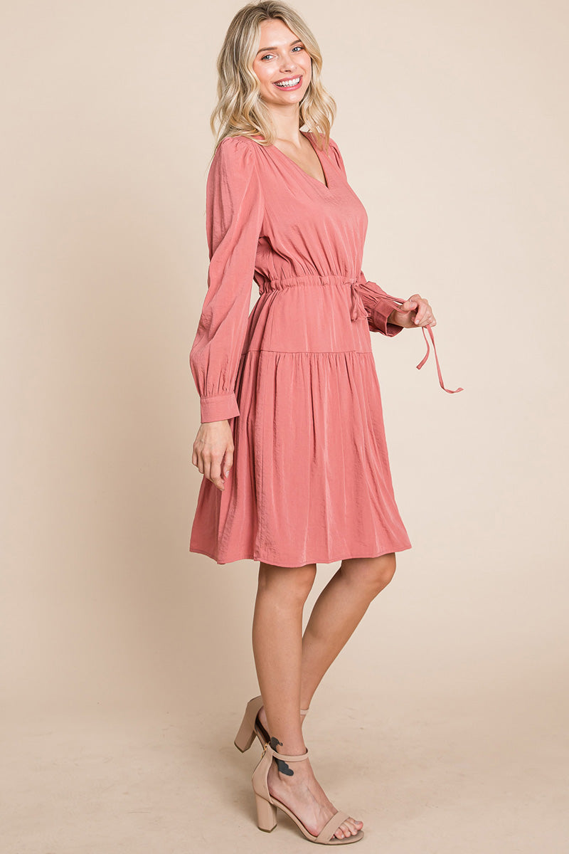 A stylish Long Sleeve Tiered Waist String Ruched Dress featuring a V-neck, long sleeves, and a tiered waist design, perfect for various occasions.