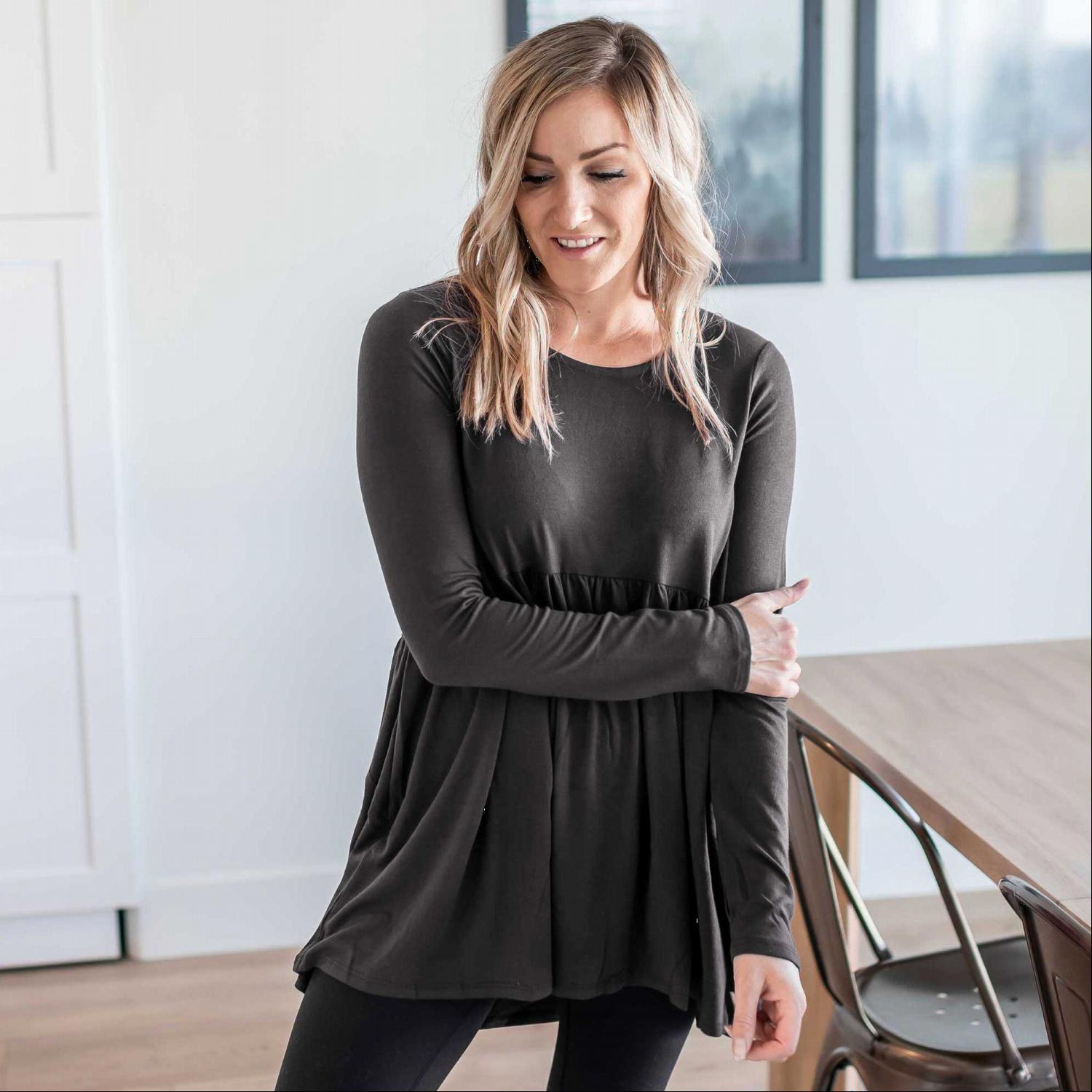 A stylish Long Sleeve With Waist Shirring Top featuring unique pleats and a round neck, perfect for casual or work wear.