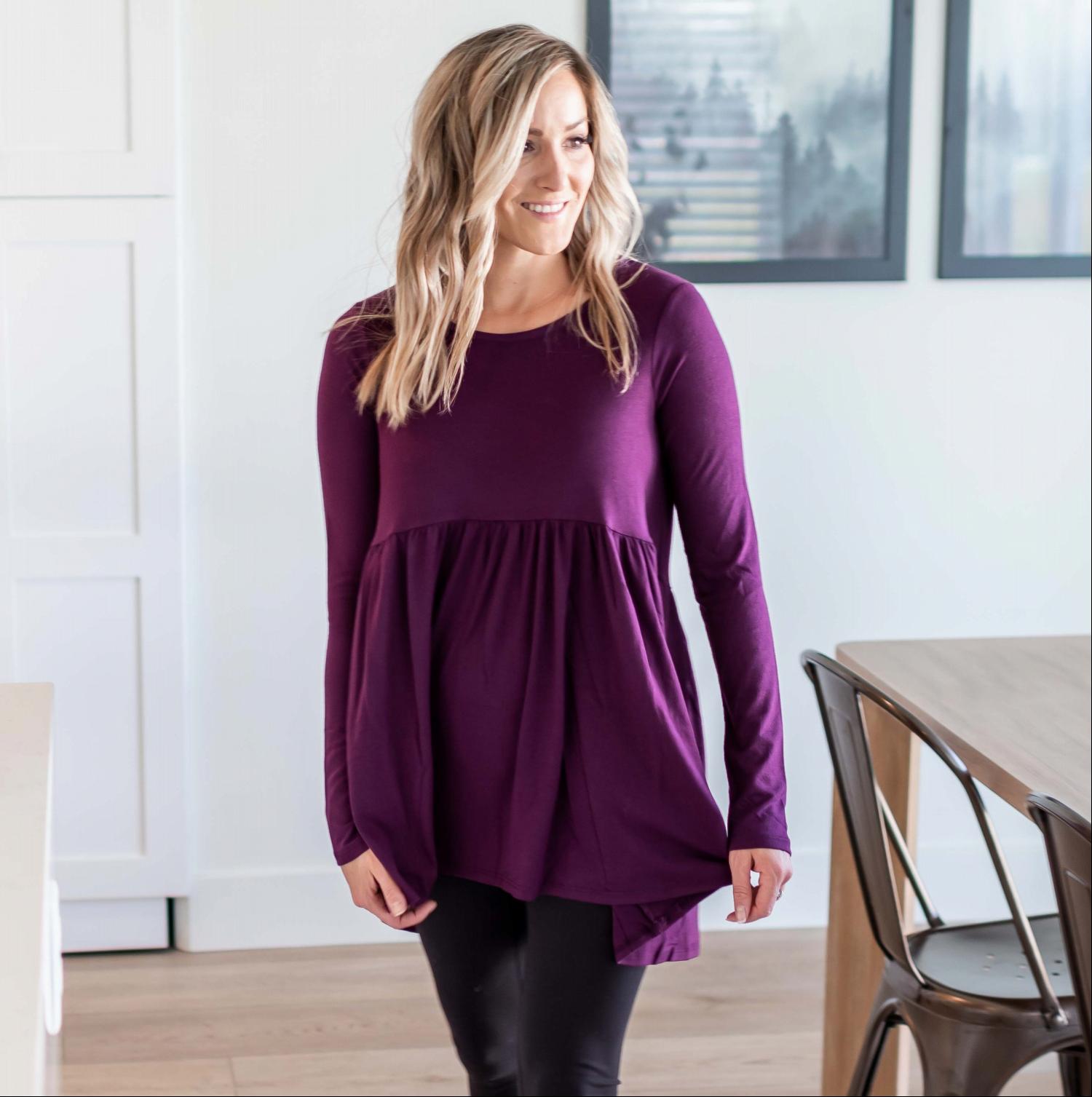 A stylish Long Sleeve With Waist Shirring Top featuring unique pleats and a round neck, perfect for casual or work wear.