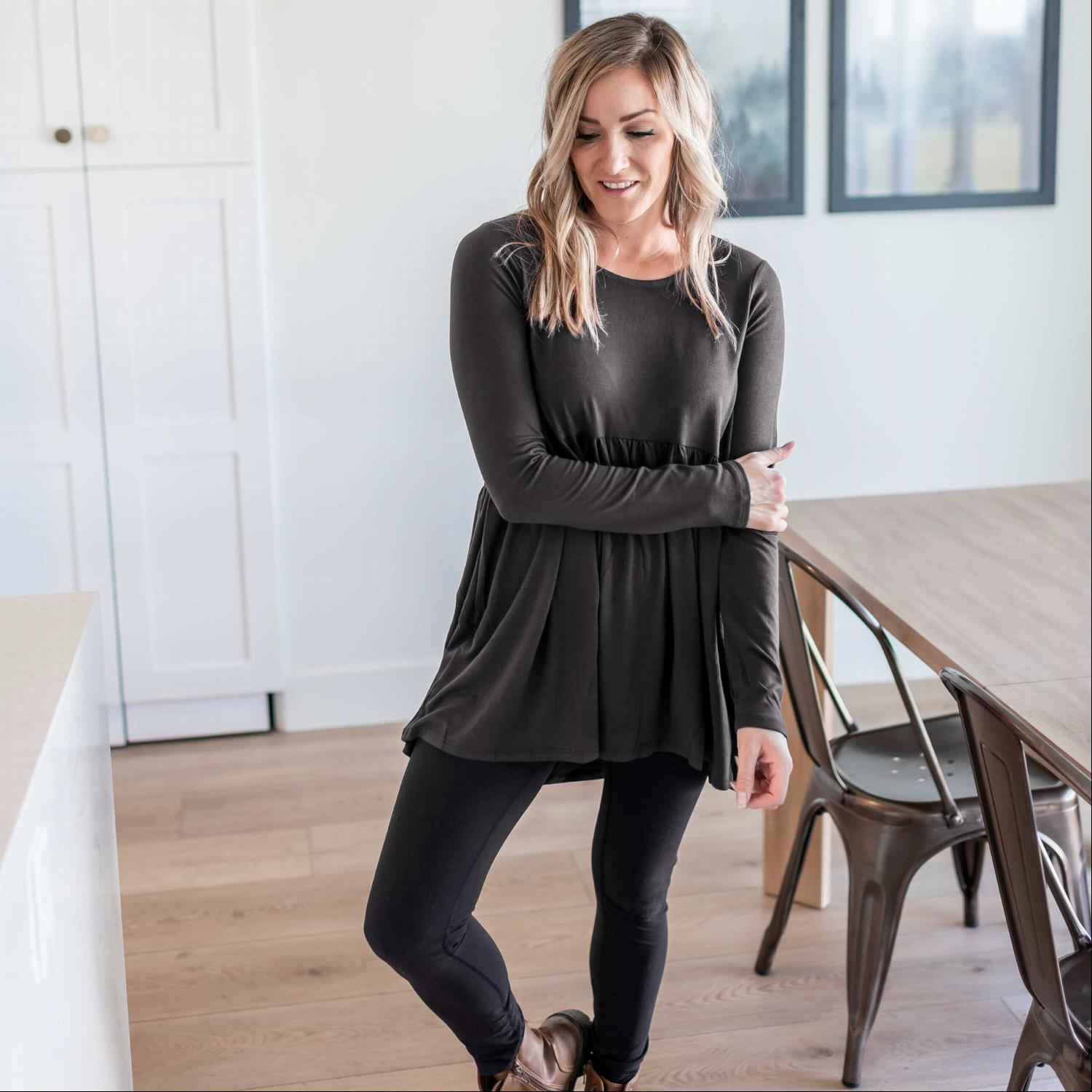 A stylish Long Sleeve With Waist Shirring Top featuring unique pleats and a round neck, perfect for casual or work wear.