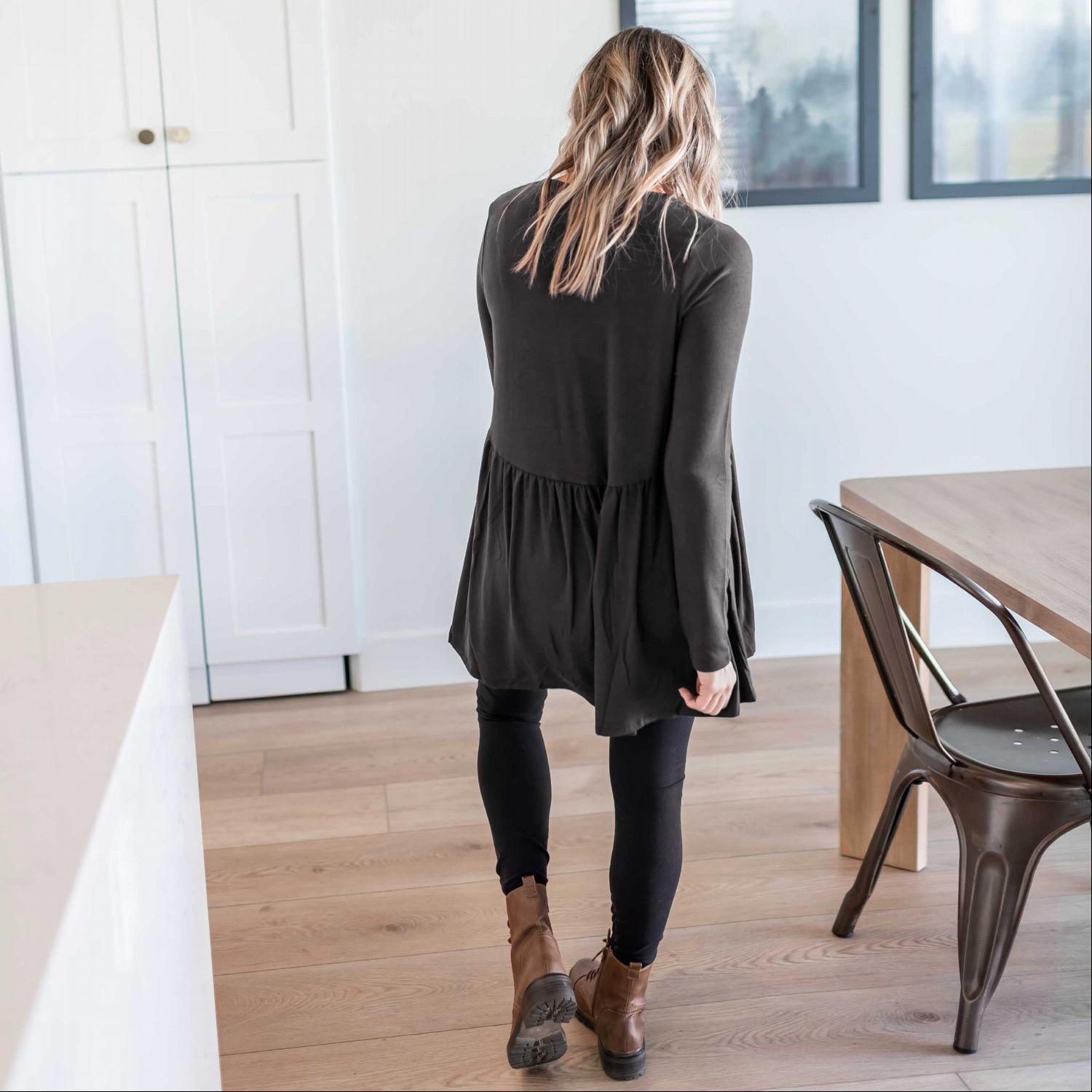 A stylish Long Sleeve With Waist Shirring Top featuring unique pleats and a round neck, perfect for casual or work wear.