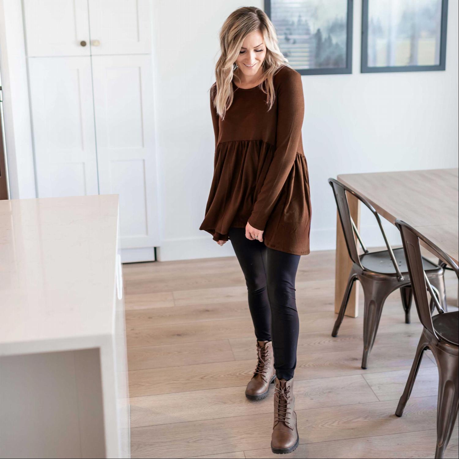 A stylish Long Sleeve With Waist Shirring Top featuring unique pleats and a round neck, perfect for casual or work wear.