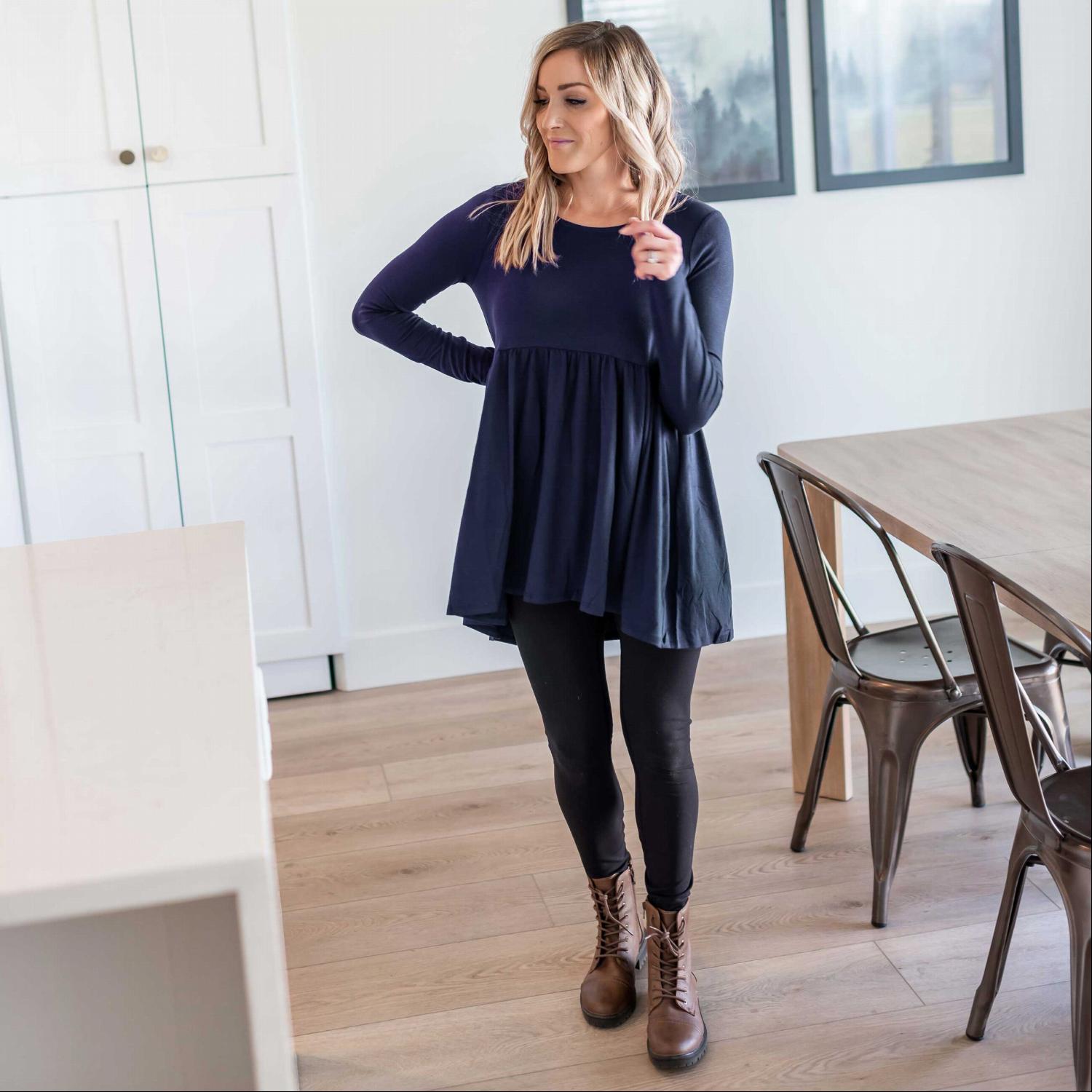 A stylish Long Sleeve With Waist Shirring Top featuring unique pleats and a round neck, perfect for casual or work wear.