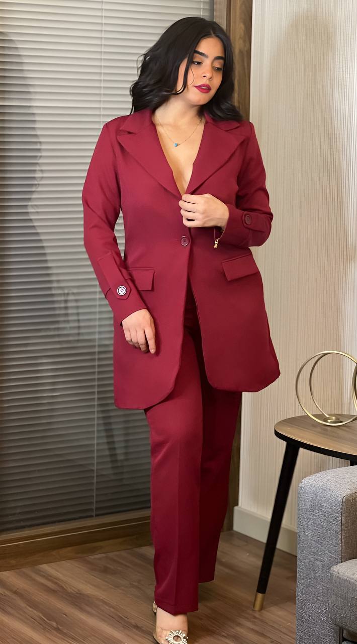 A stylish long sleeved jacket paired with wide leg pants, perfect for formal occasions.