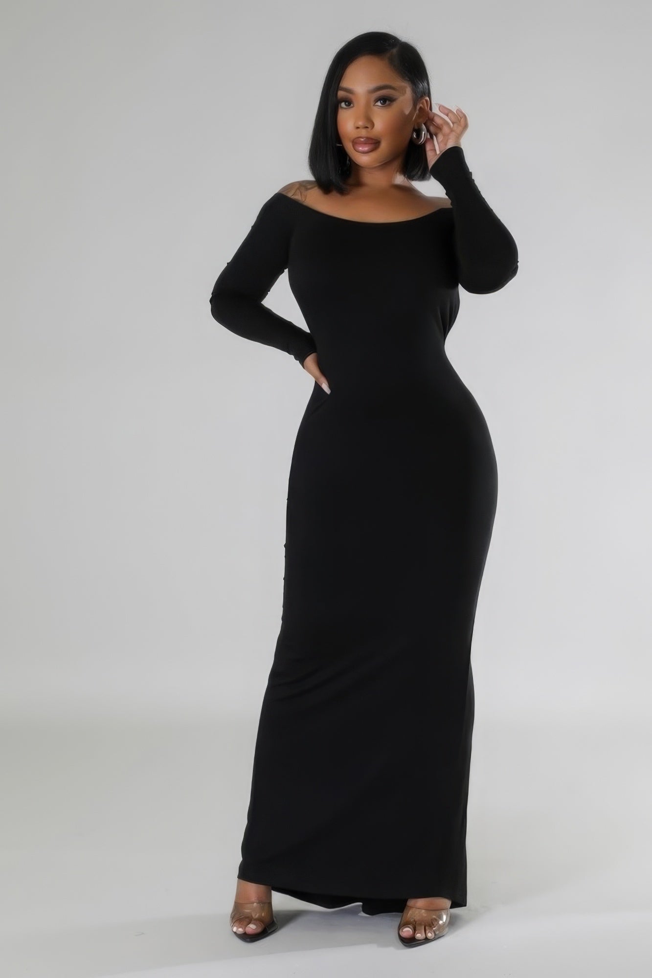 A stylish Long Sleeves Stretch Dress in rich brown color, featuring a round neckline, long sleeves, and an open back design.