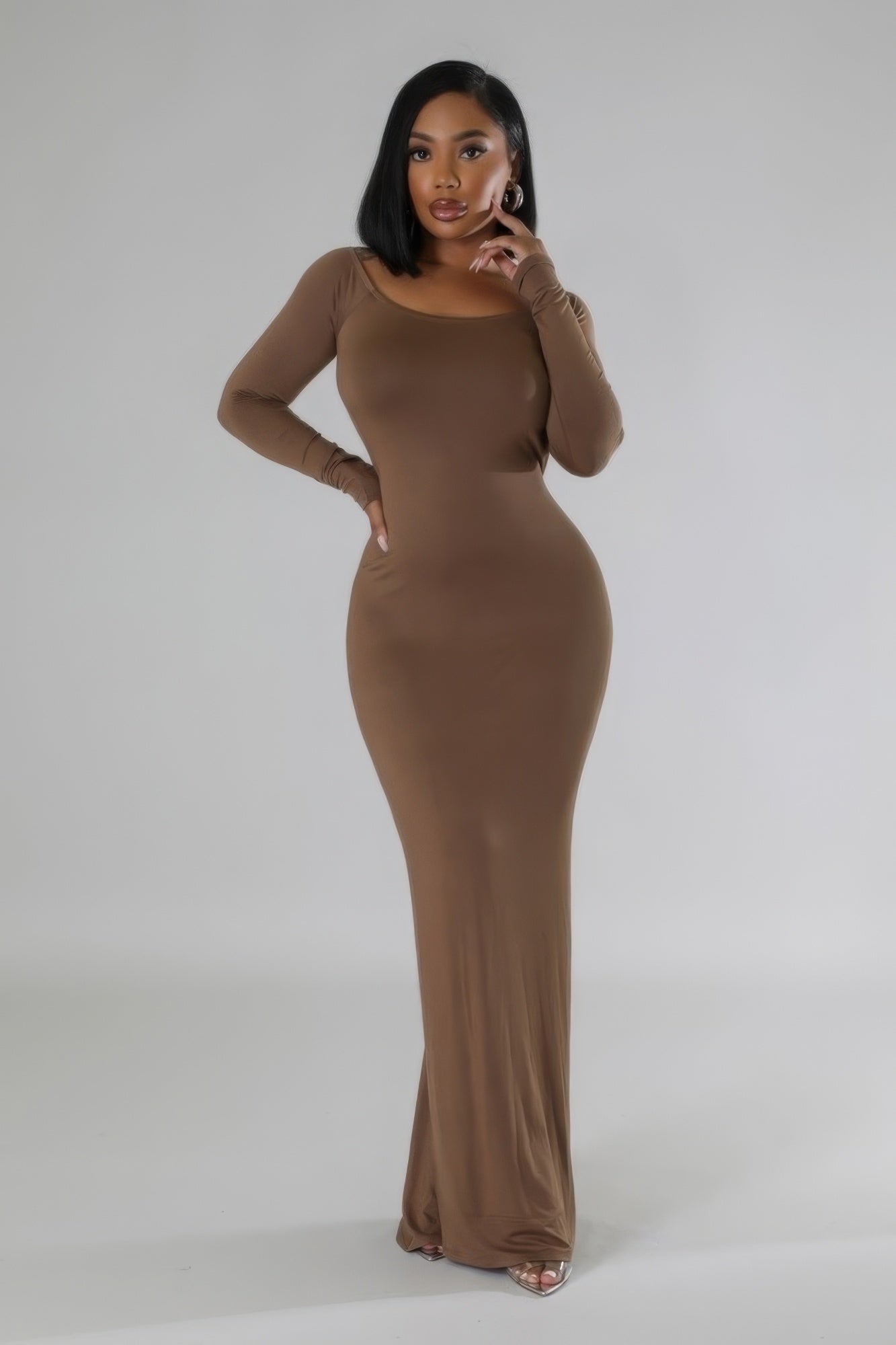 A stylish Long Sleeves Stretch Dress in rich brown color, featuring a round neckline, long sleeves, and an open back design.