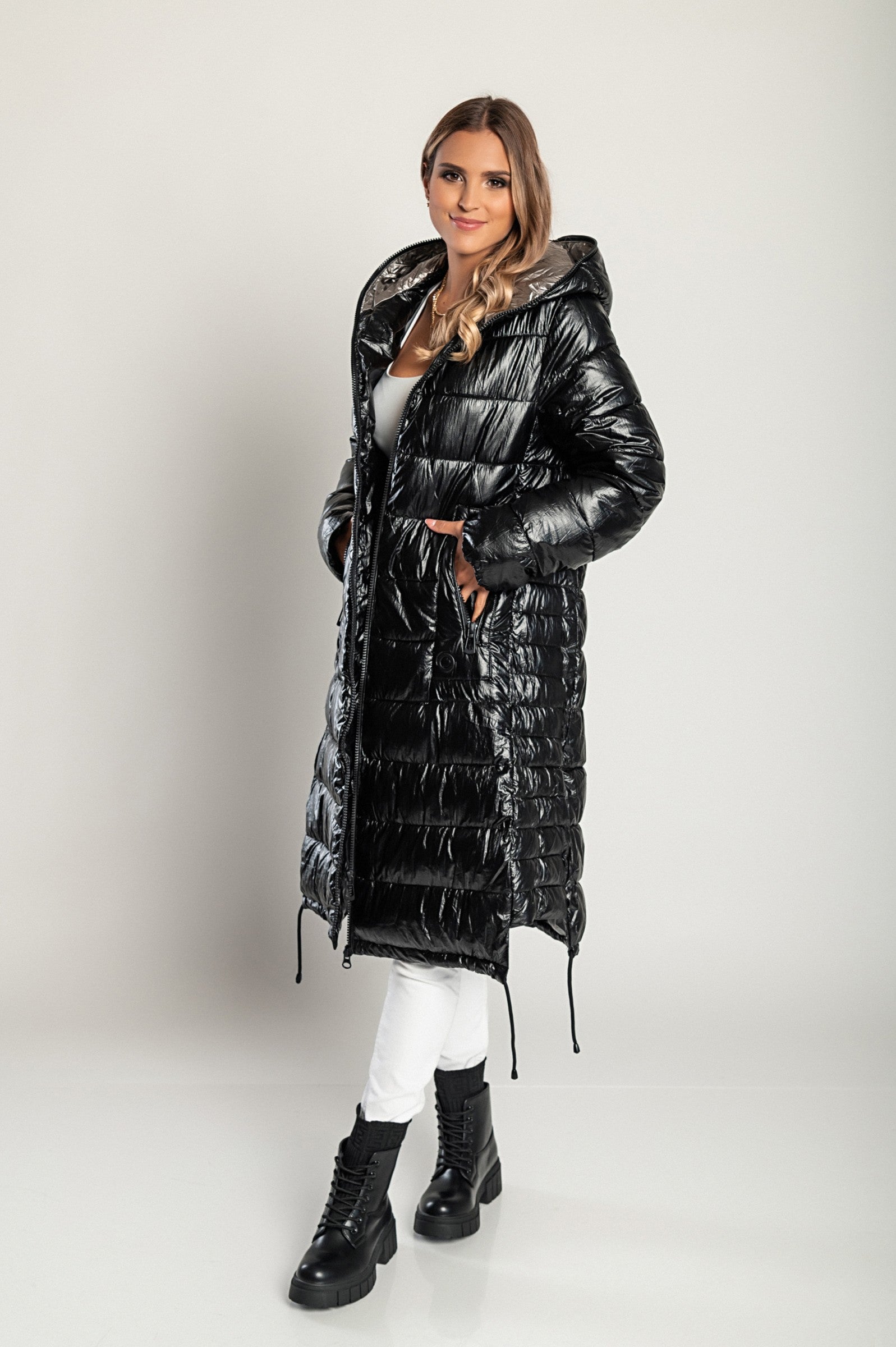 Long winter jacket with hood, item code 2237, in black, featuring a quilted design, high collar, and side zipper pockets.