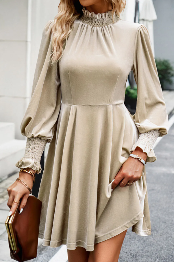 Beige loose dress with high neck and long puffed sleeves, perfect for casual outings.