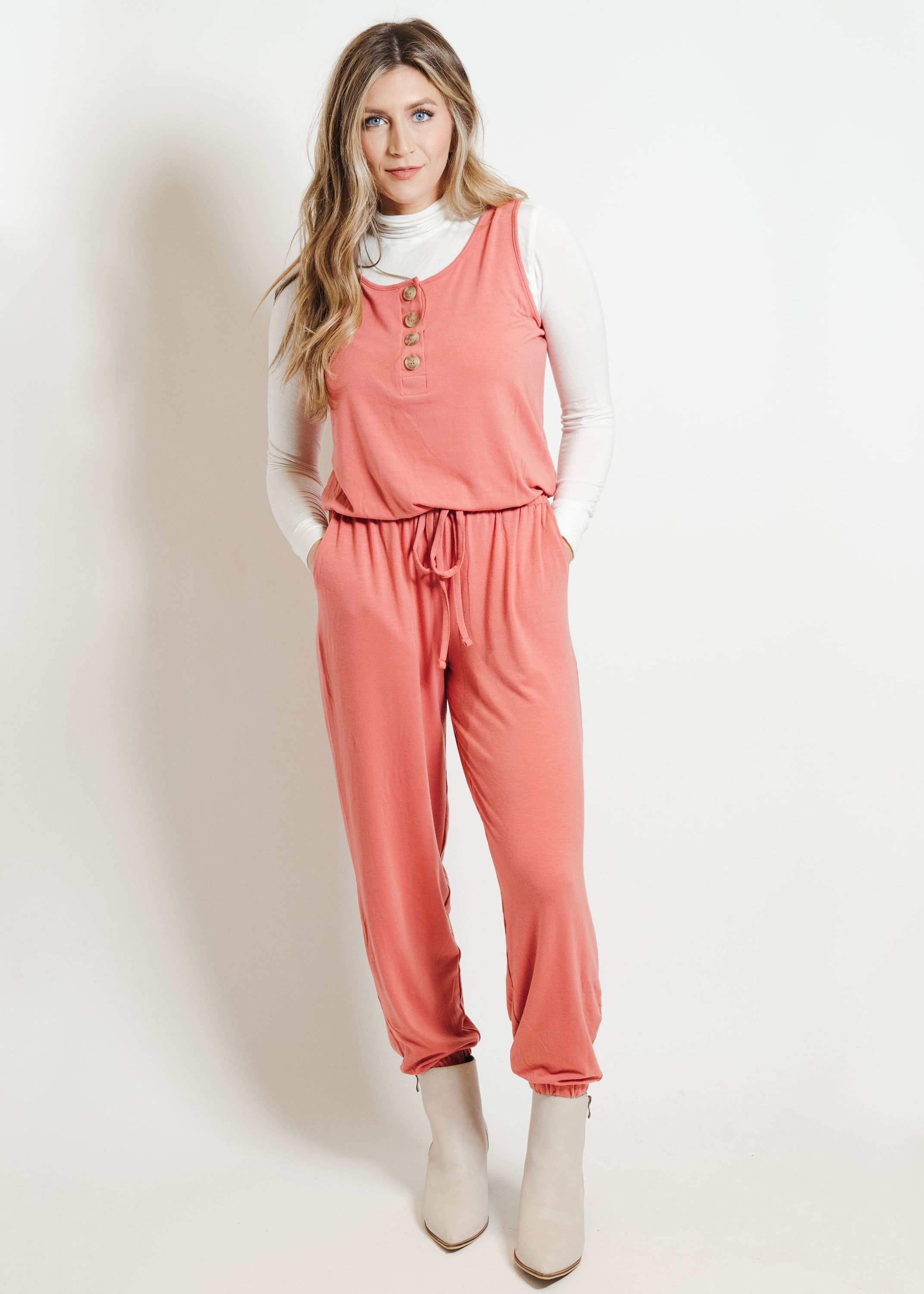 A stylish ash rose lounge jumpsuit, showcasing its soft fabric and versatile design, perfect for casual outings or lounging at home.