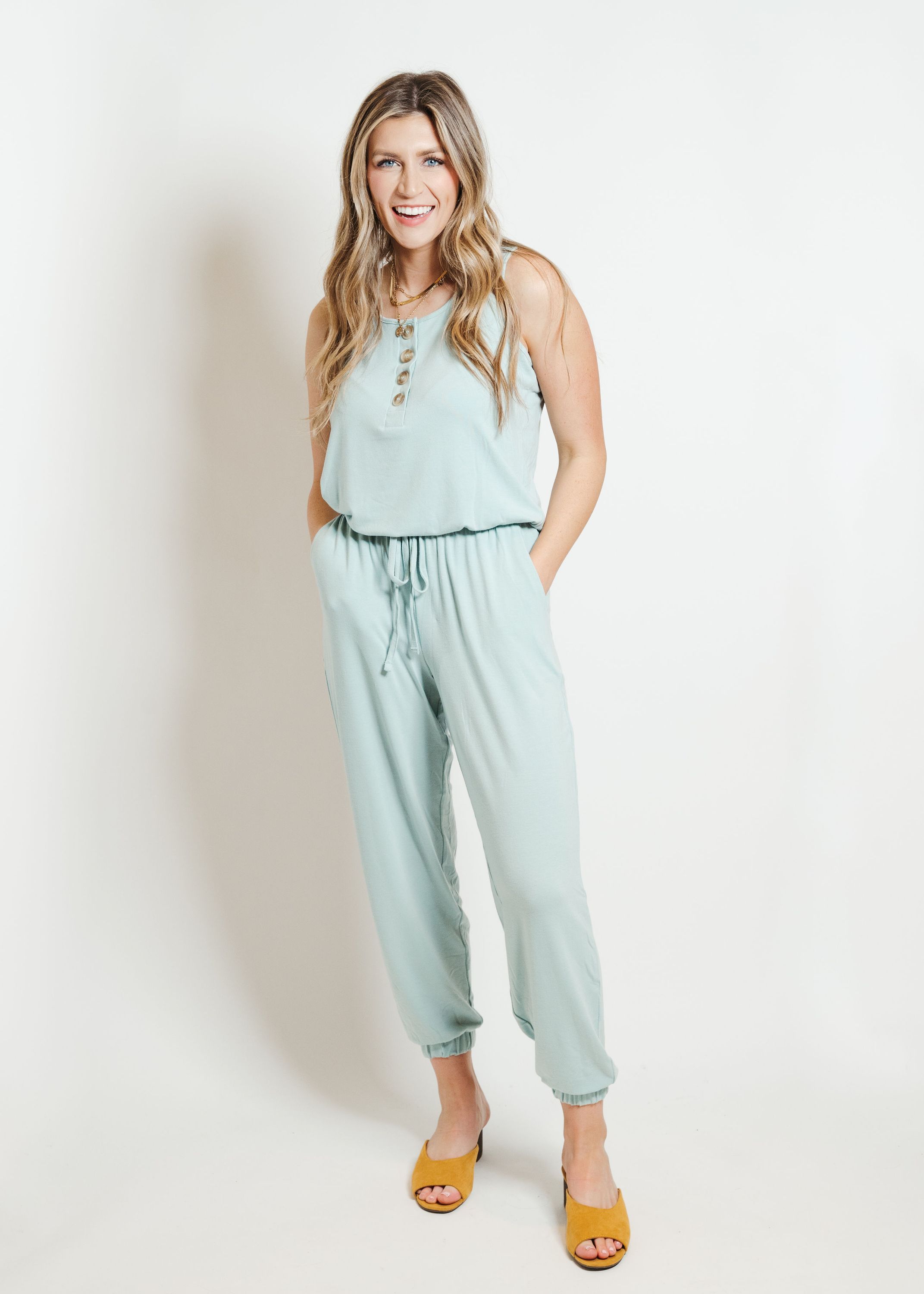 Light green lounge jumpsuit displayed on a mannequin, showcasing its comfortable fit and stylish design.