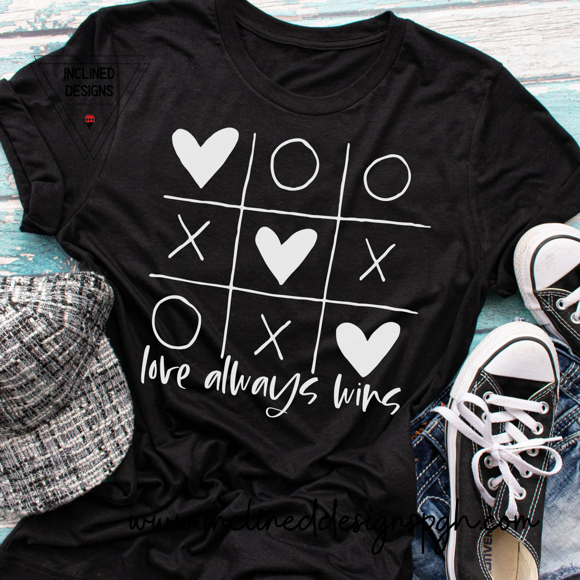 A stylish adult tee featuring the phrase 'Love Always Wins' in vibrant screen print, symbolizing love and inclusivity.