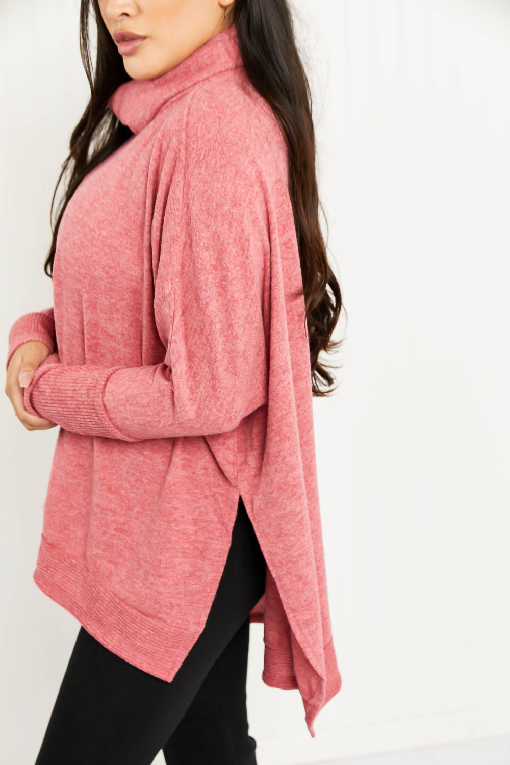 Cozy oversized Love and Cuddles Cowl Neck Poncho Sweater in a solid color, featuring a stylish cowl neck and high-low hem.