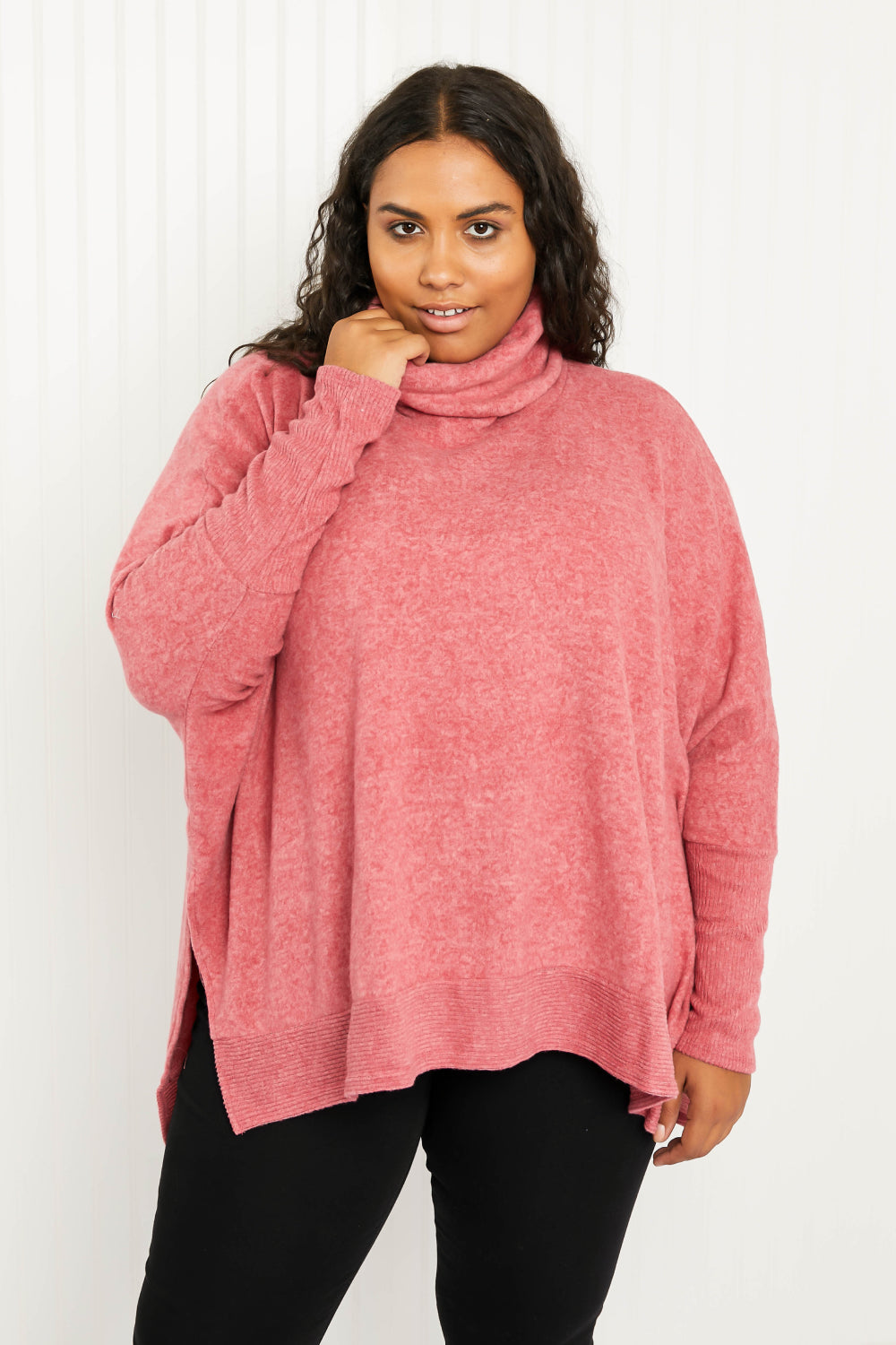 Cozy oversized Love and Cuddles Cowl Neck Poncho Sweater in a solid color, featuring a stylish cowl neck and high-low hem.