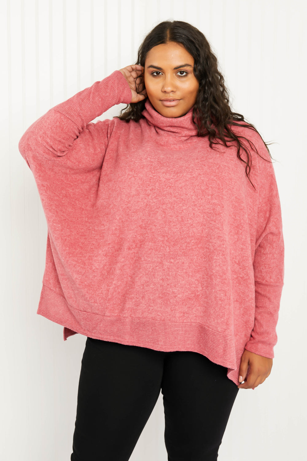 Cozy oversized Love and Cuddles Cowl Neck Poncho Sweater in a solid color, featuring a stylish cowl neck and high-low hem.