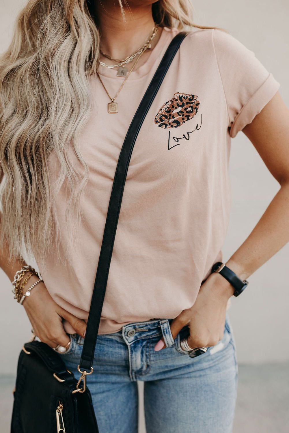 A stylish Love Graphic Tee featuring a chic leopard kiss graphic, perfect for summer wear.