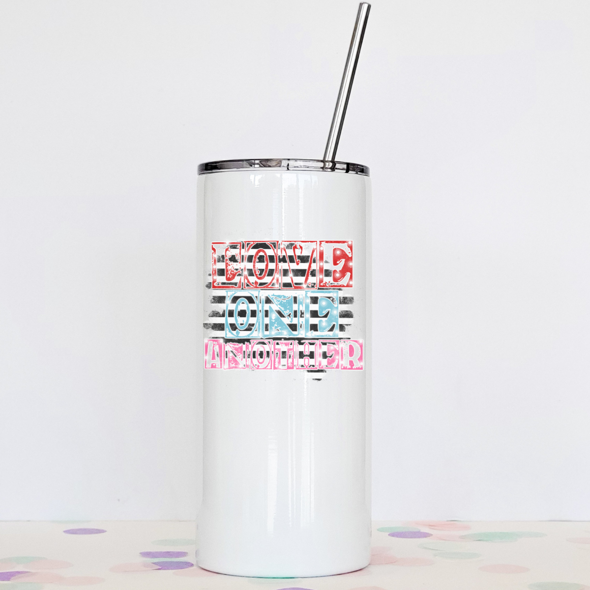 Love One Another tumbler with clear slider lid and stainless steel straw, showcasing its sleek design and double-walled construction.