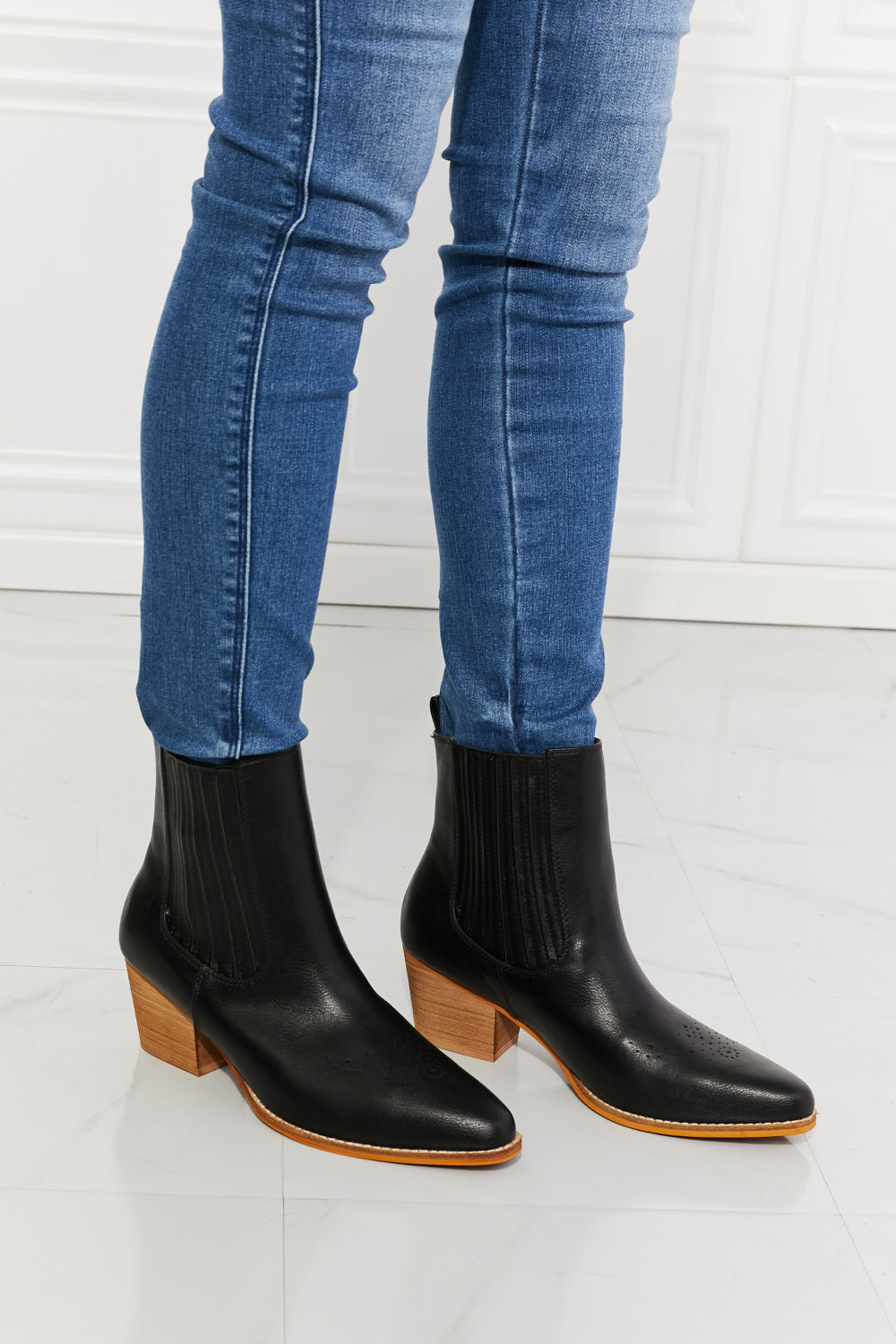 Love the Journey Stacked Heel Chelsea Boot in Black featuring a pointed toe and stacked heel design, crafted from PU leather.