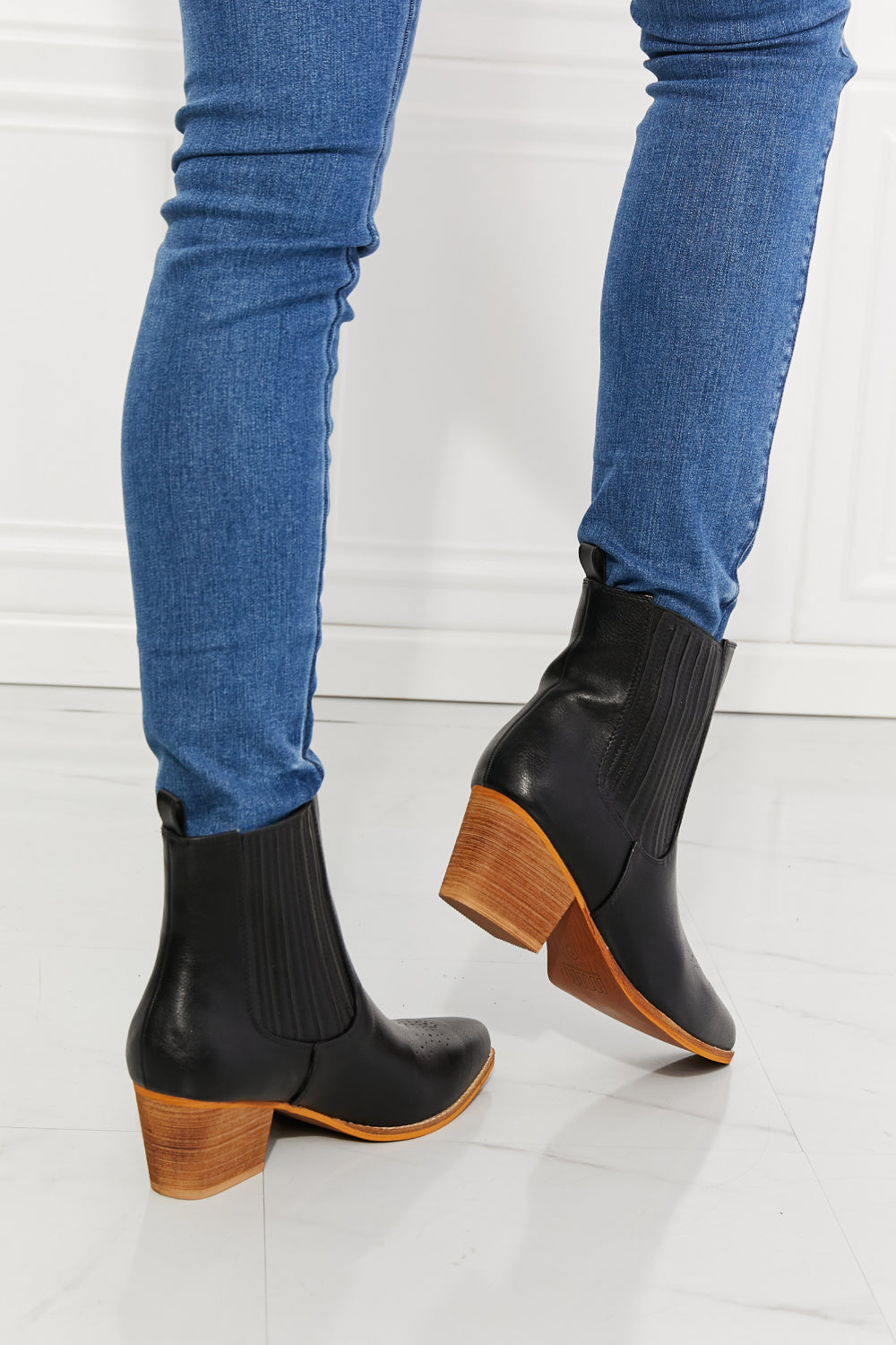 Love the Journey Stacked Heel Chelsea Boot in Black featuring a pointed toe and stacked heel design, crafted from PU leather.