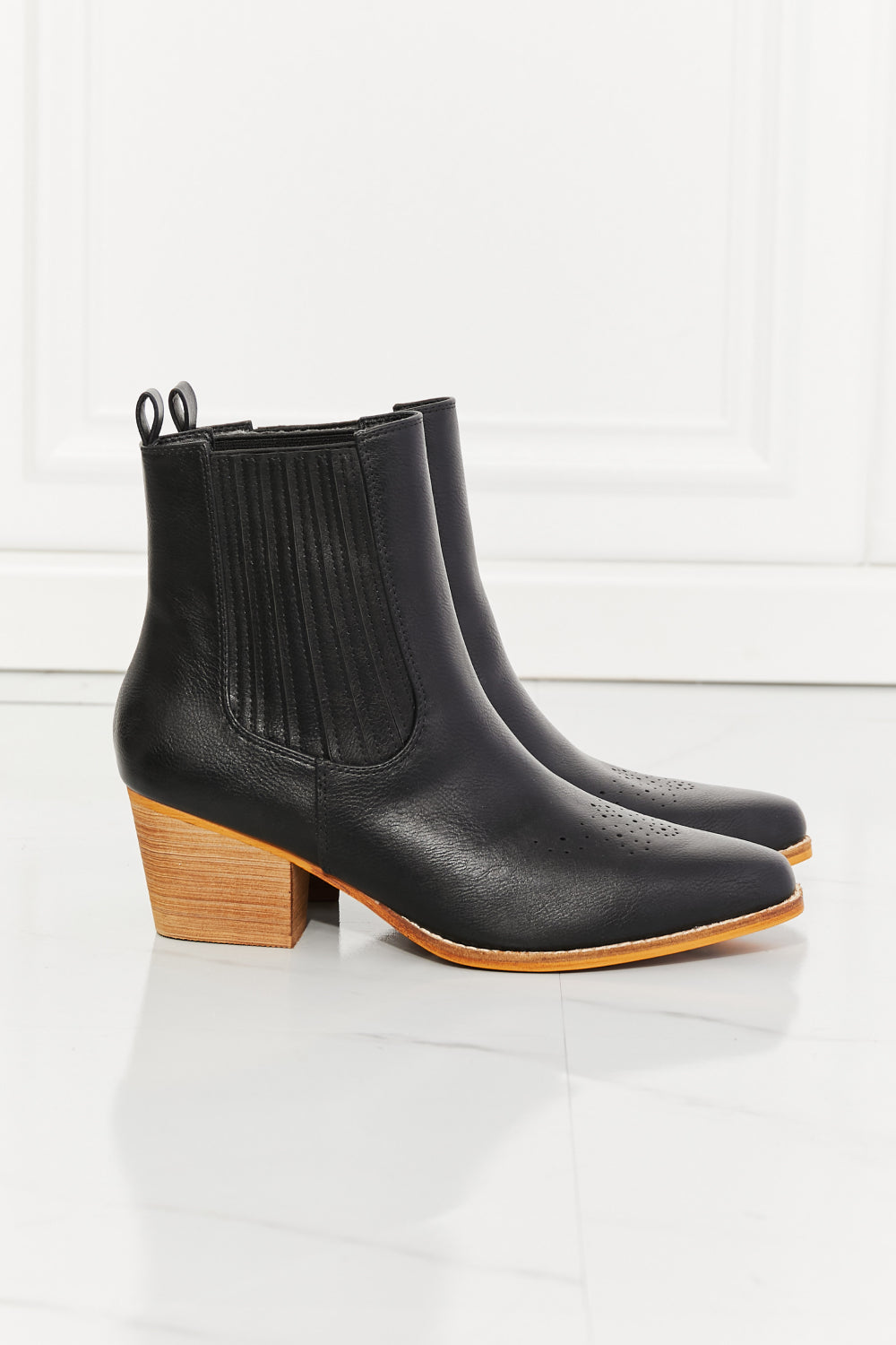 Love the Journey Stacked Heel Chelsea Boot in Black featuring a pointed toe and stacked heel design, crafted from PU leather.