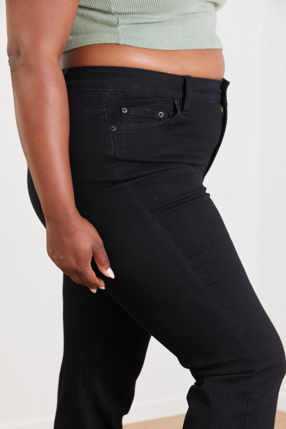 Lucia Bootcut Jeans displayed on a mannequin, showcasing the classic denim design with a flattering bootcut silhouette.