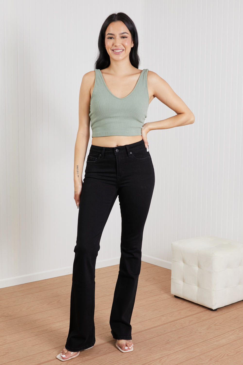 Lucia Bootcut Jeans displayed on a mannequin, showcasing the classic denim design with a flattering bootcut silhouette.