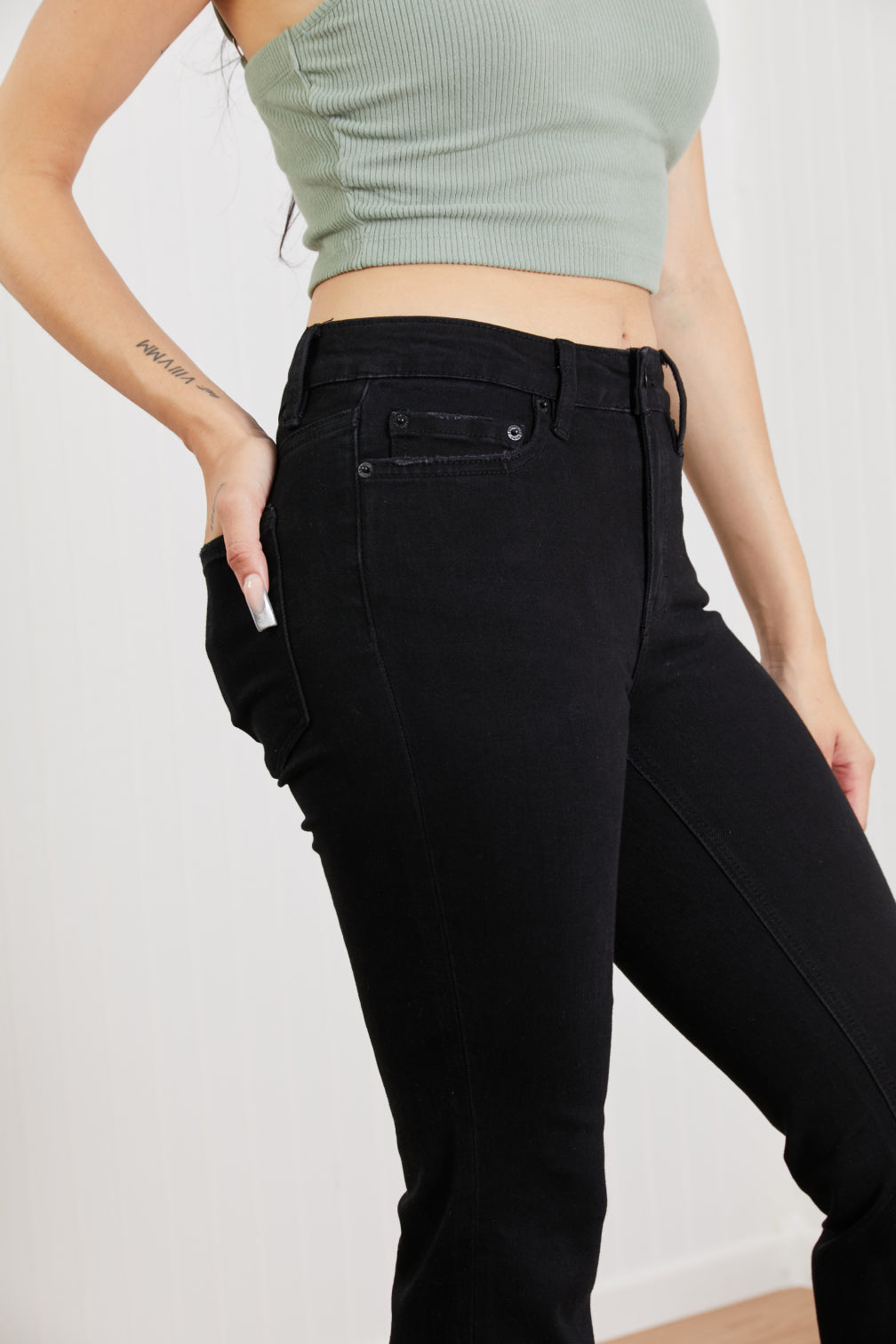 Lucia Bootcut Jeans displayed on a mannequin, showcasing the classic denim design with a flattering bootcut silhouette.