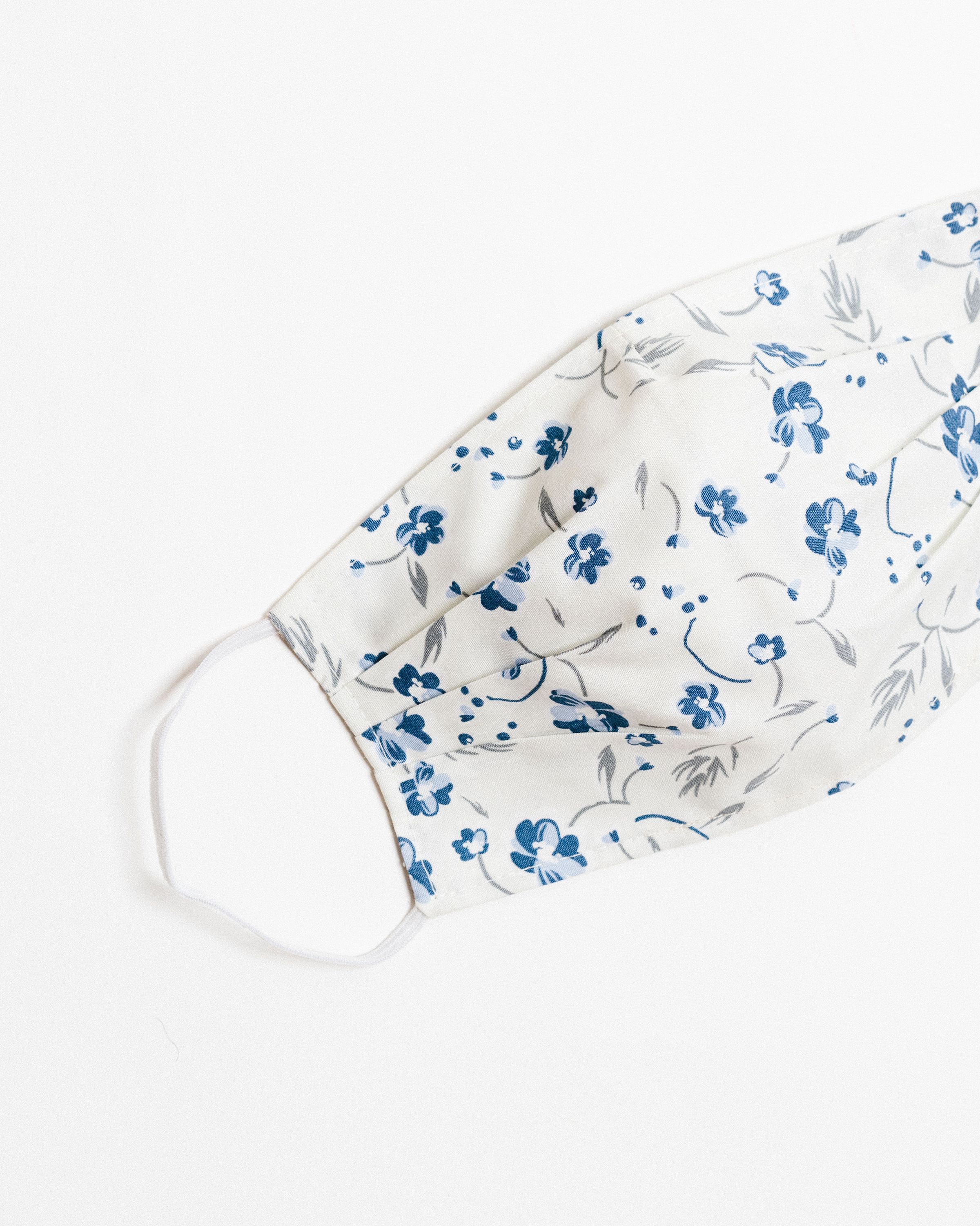 Lucy Ivory Face Mask made of 100% cotton, featuring pleats for comfort and a pocket for filters.