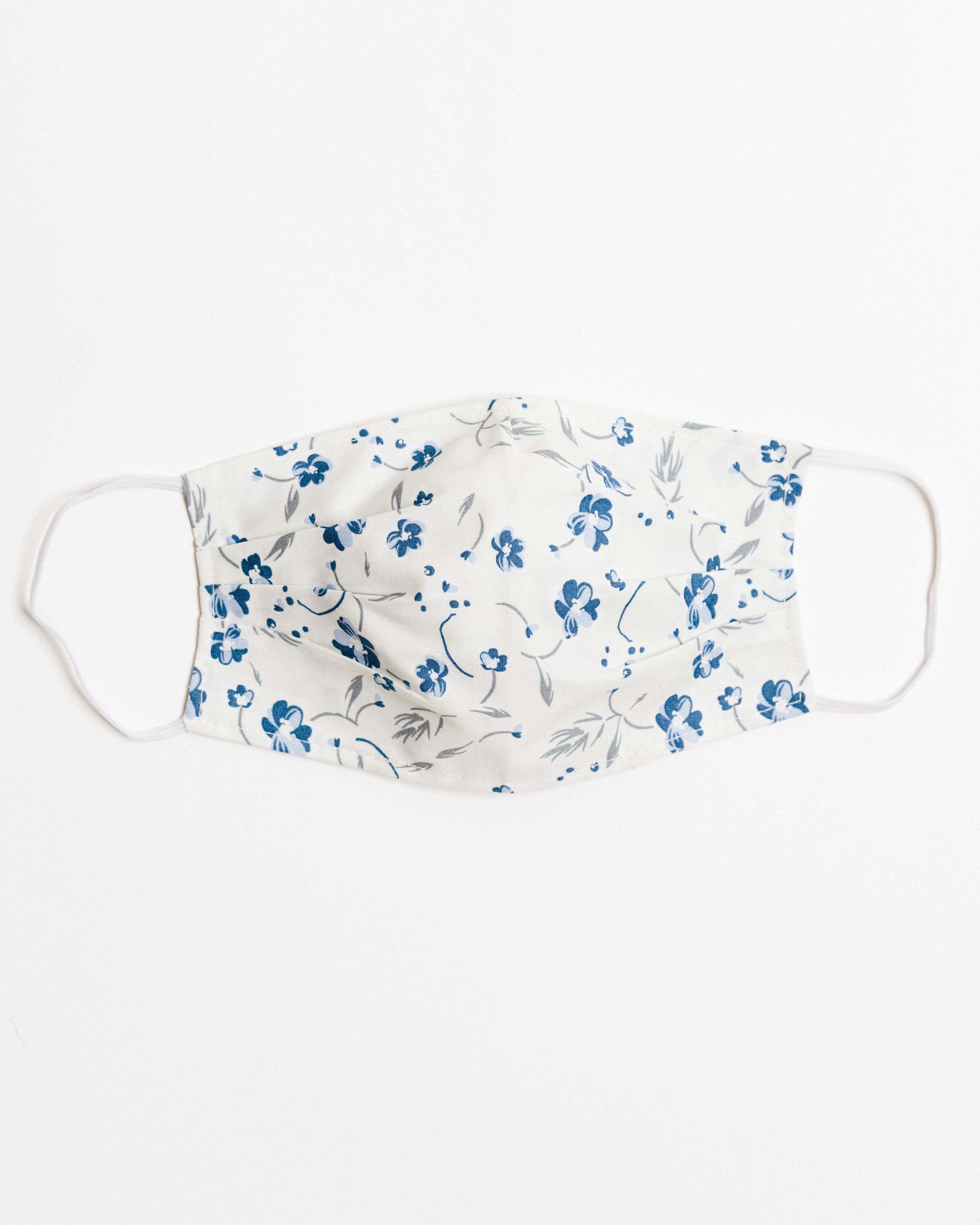 Lucy Ivory Face Mask made of 100% cotton, featuring pleats for comfort and a pocket for filters.