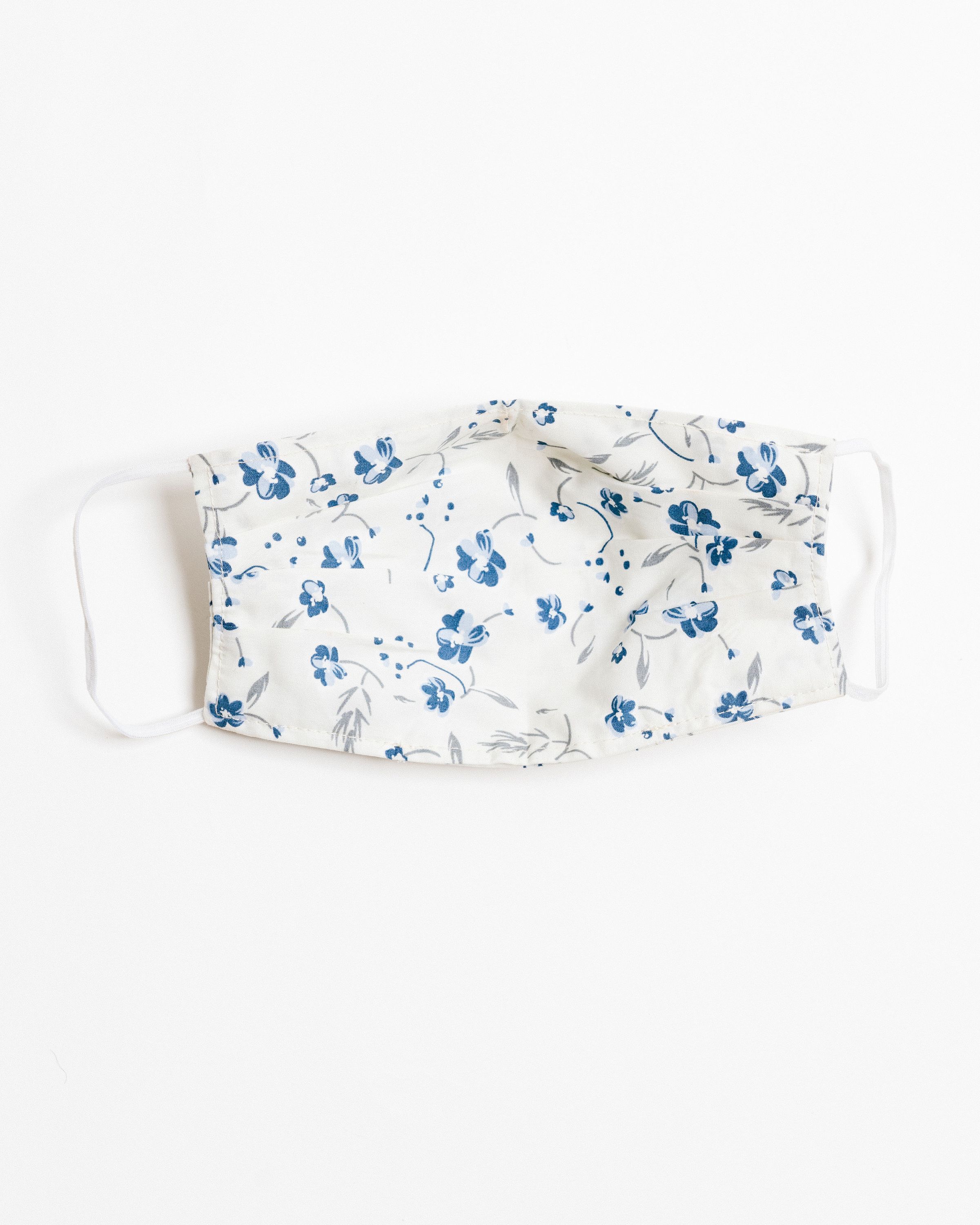 Lucy Ivory Face Mask made of 100% cotton, featuring pleats for comfort and a pocket for filters.