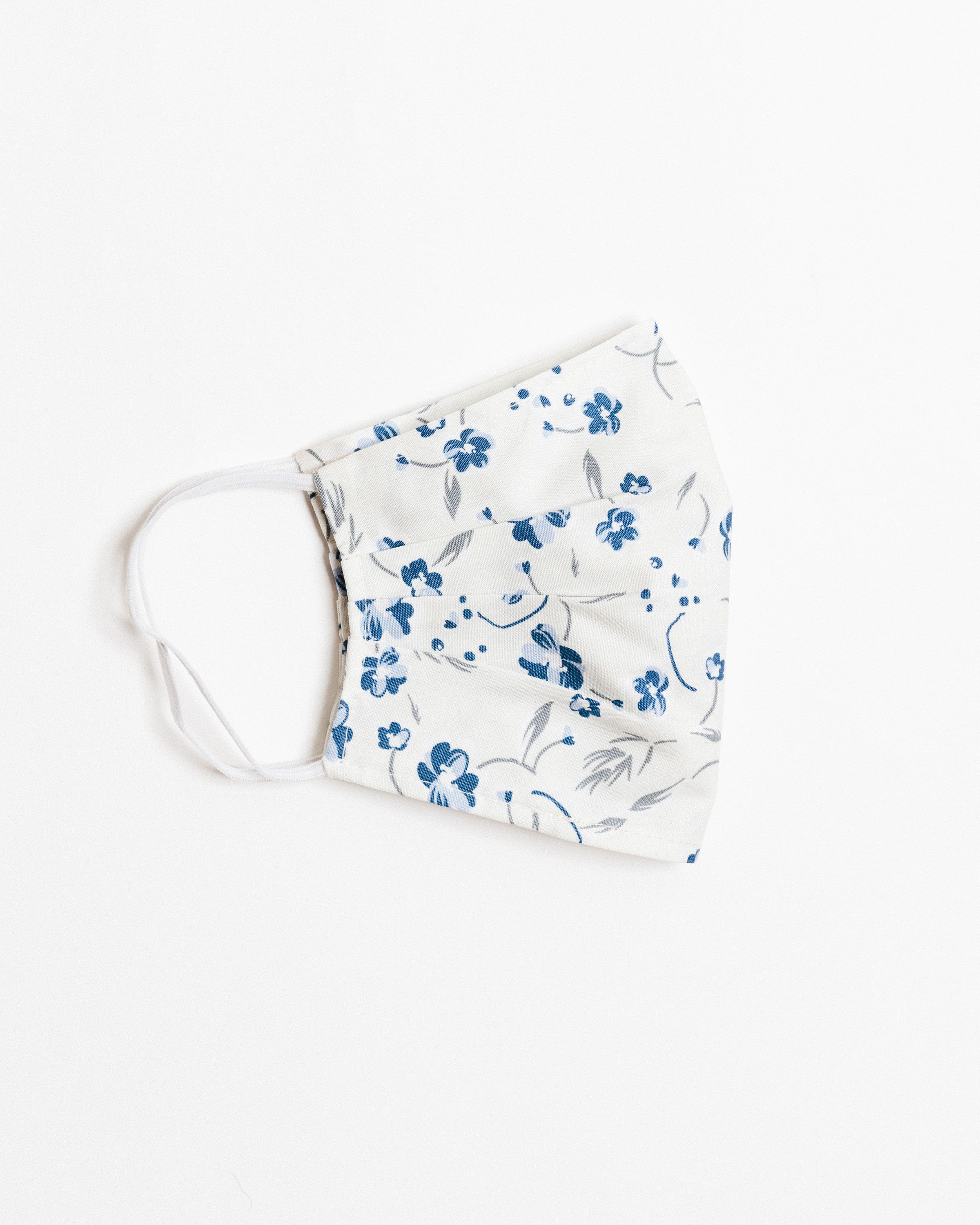 Lucy Ivory Face Mask made of 100% cotton, featuring pleats for comfort and a pocket for filters.