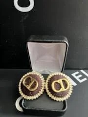 Lux Beautiful CD Earrings made of genuine leather in brown and gold colors, showcasing a stylish design.