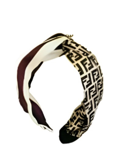 Lux HeadBand featuring a chic bow detail and grosgrain ribbon in shades of brown.