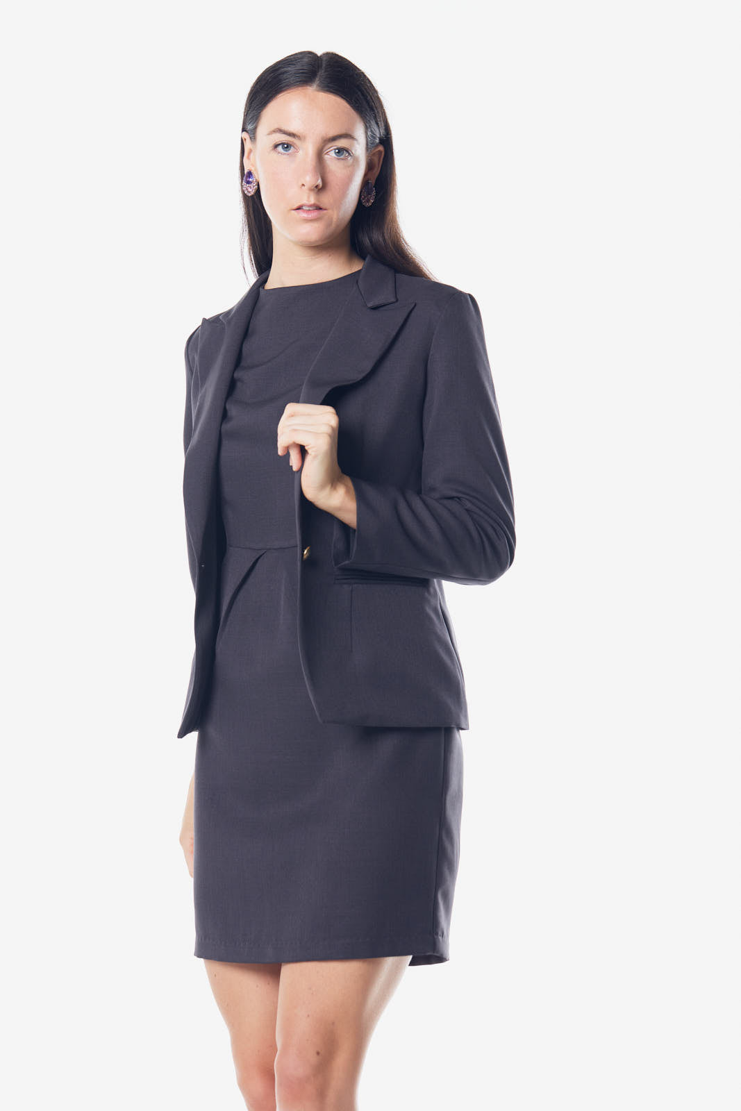 A stylish Luxe Charcoal Blazer made from 100% wool, featuring a tailored fit and elegant design, perfect for professional attire.