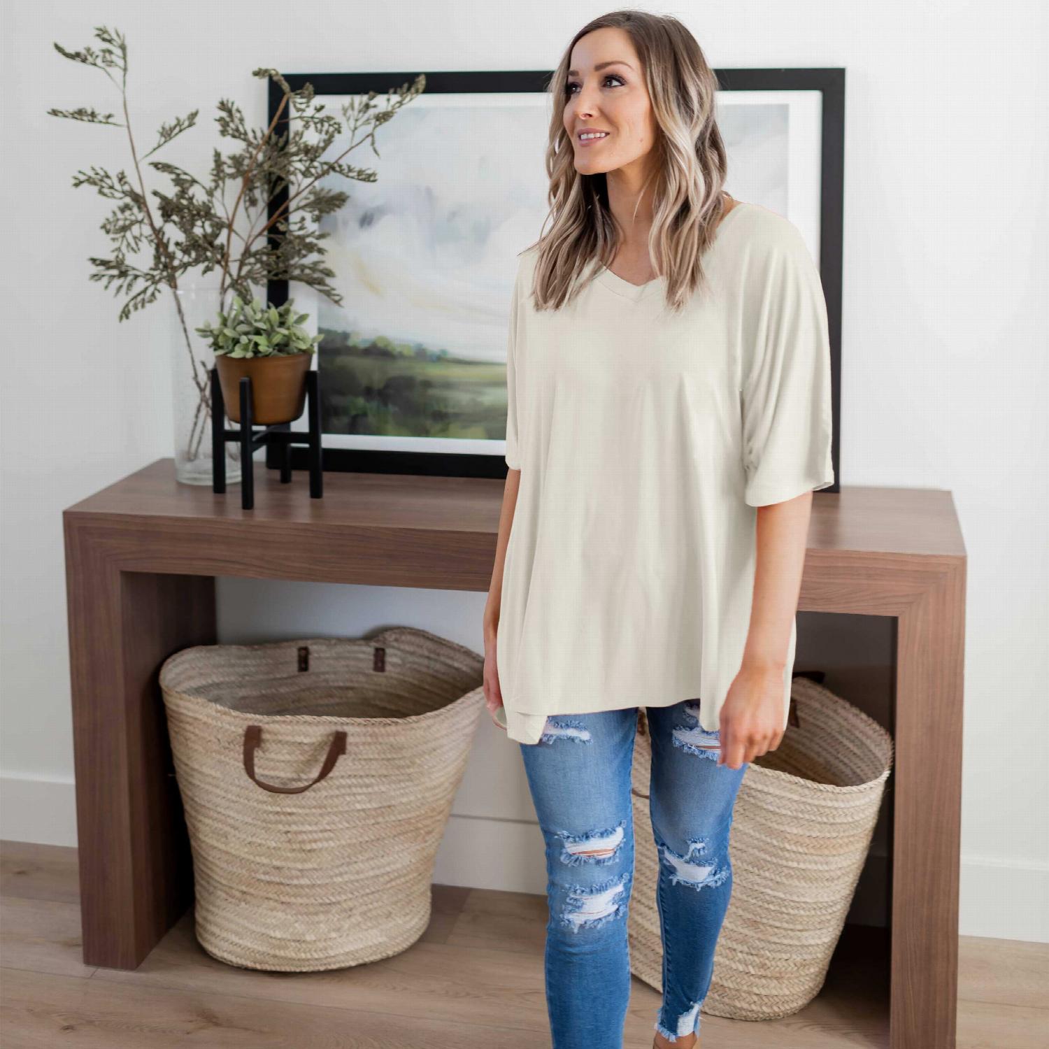 Luxe Rayon Dolman Half Sleeve V-neck Top in a stylish casual setting, showcasing its oversized design and flattering neckline.