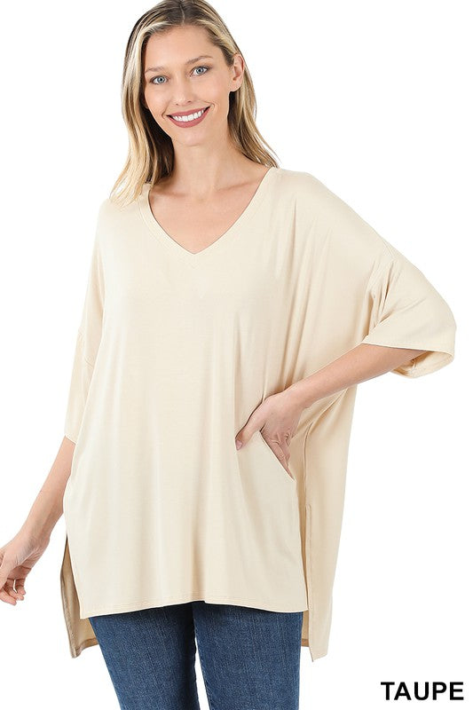 Luxe Rayon Dolman Half Sleeve V-neck Top in a stylish casual setting, showcasing its oversized design and flattering neckline.