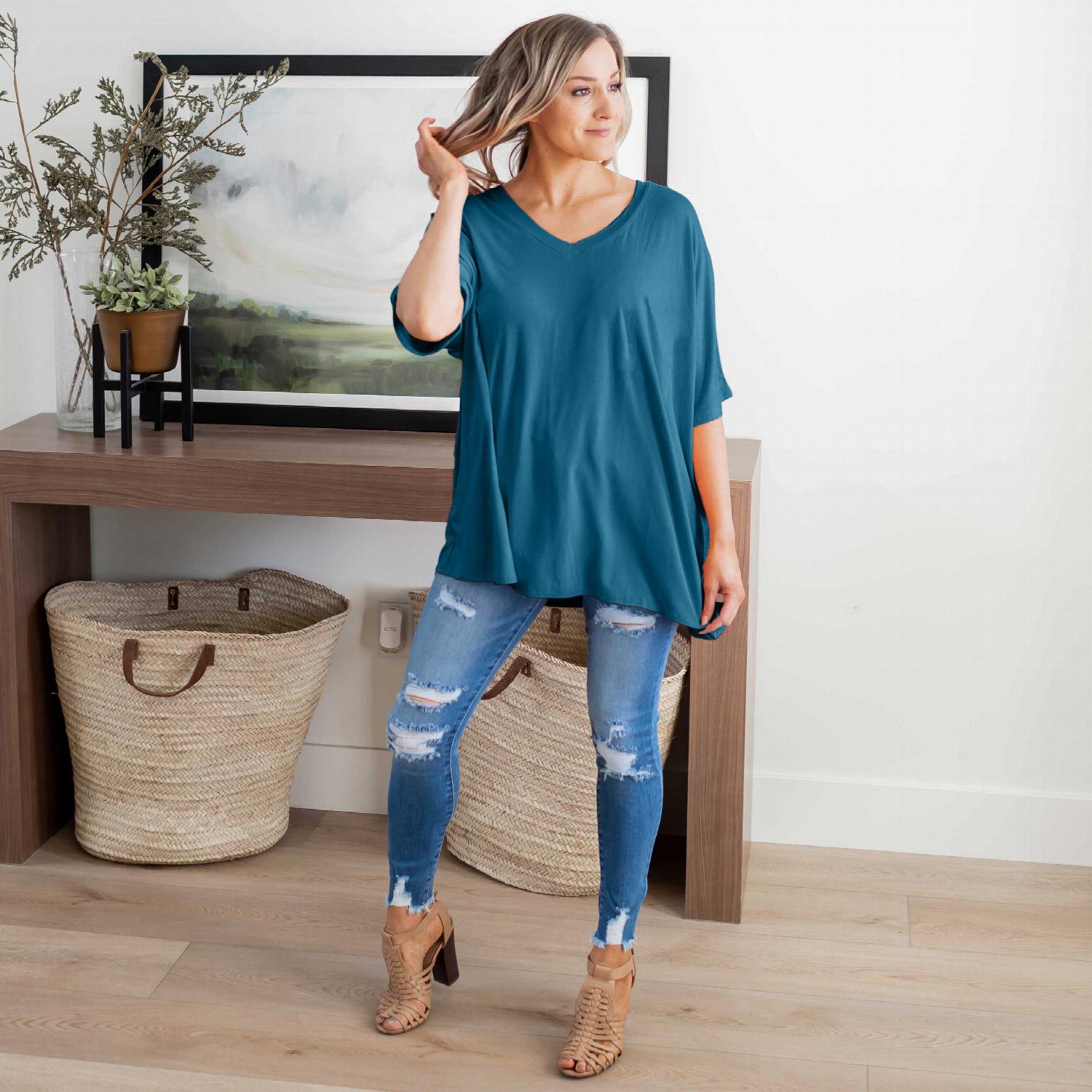 Luxe Rayon Dolman Half Sleeve V-neck Top in a stylish casual setting, showcasing its oversized design and flattering neckline.