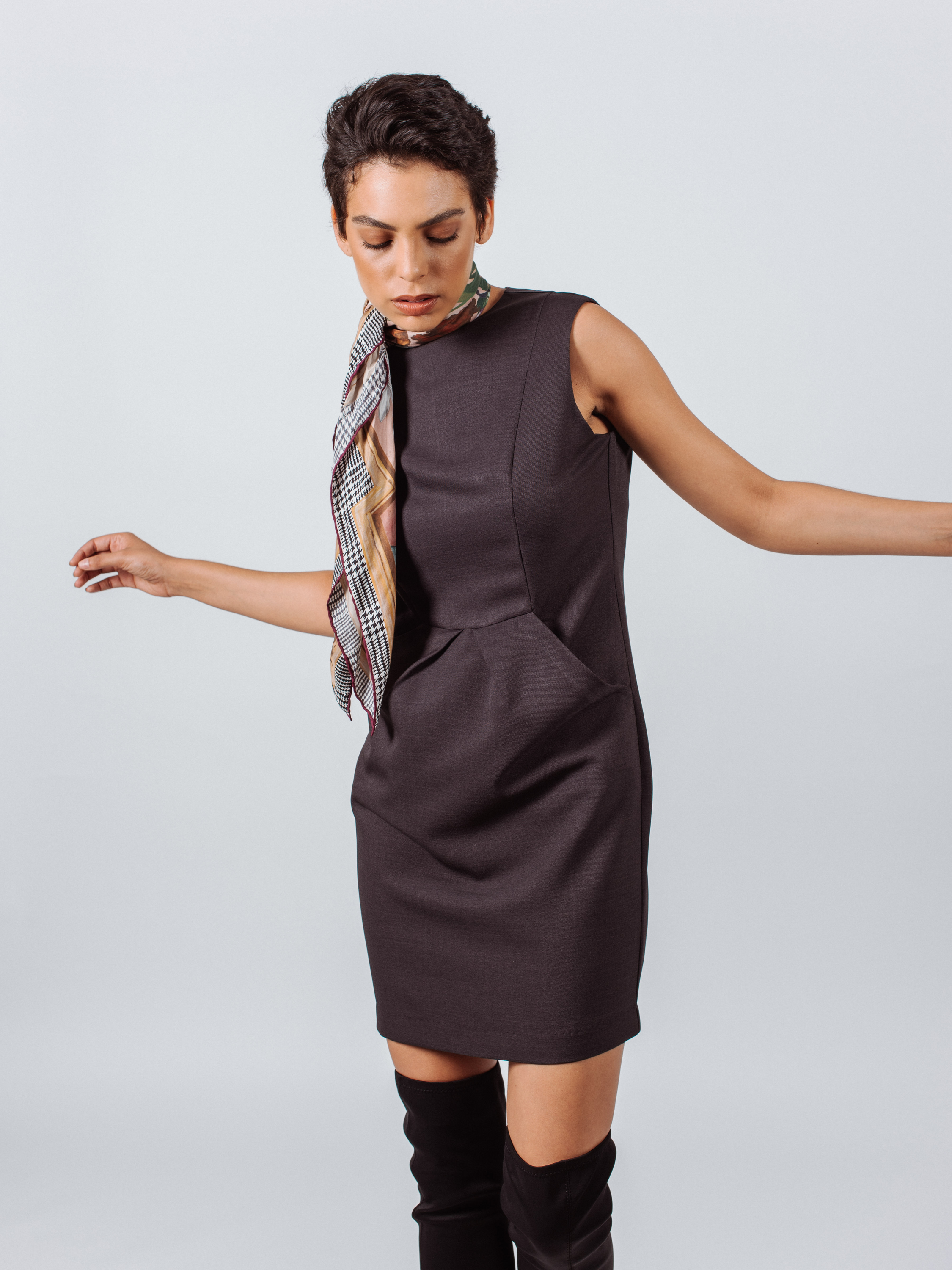 Luxe Wool Mini Dress in charcoal color, featuring pleated design and pockets, perfect for work and special occasions.