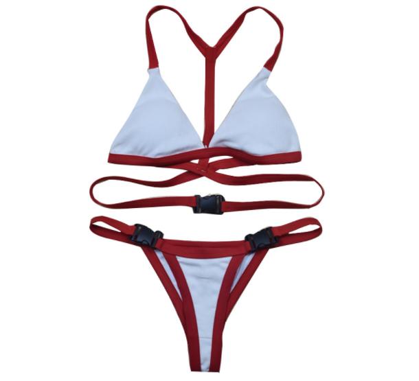 The Lydia swimwear featuring a sexy buckle back twist design with red edges, perfect for accentuating curves.