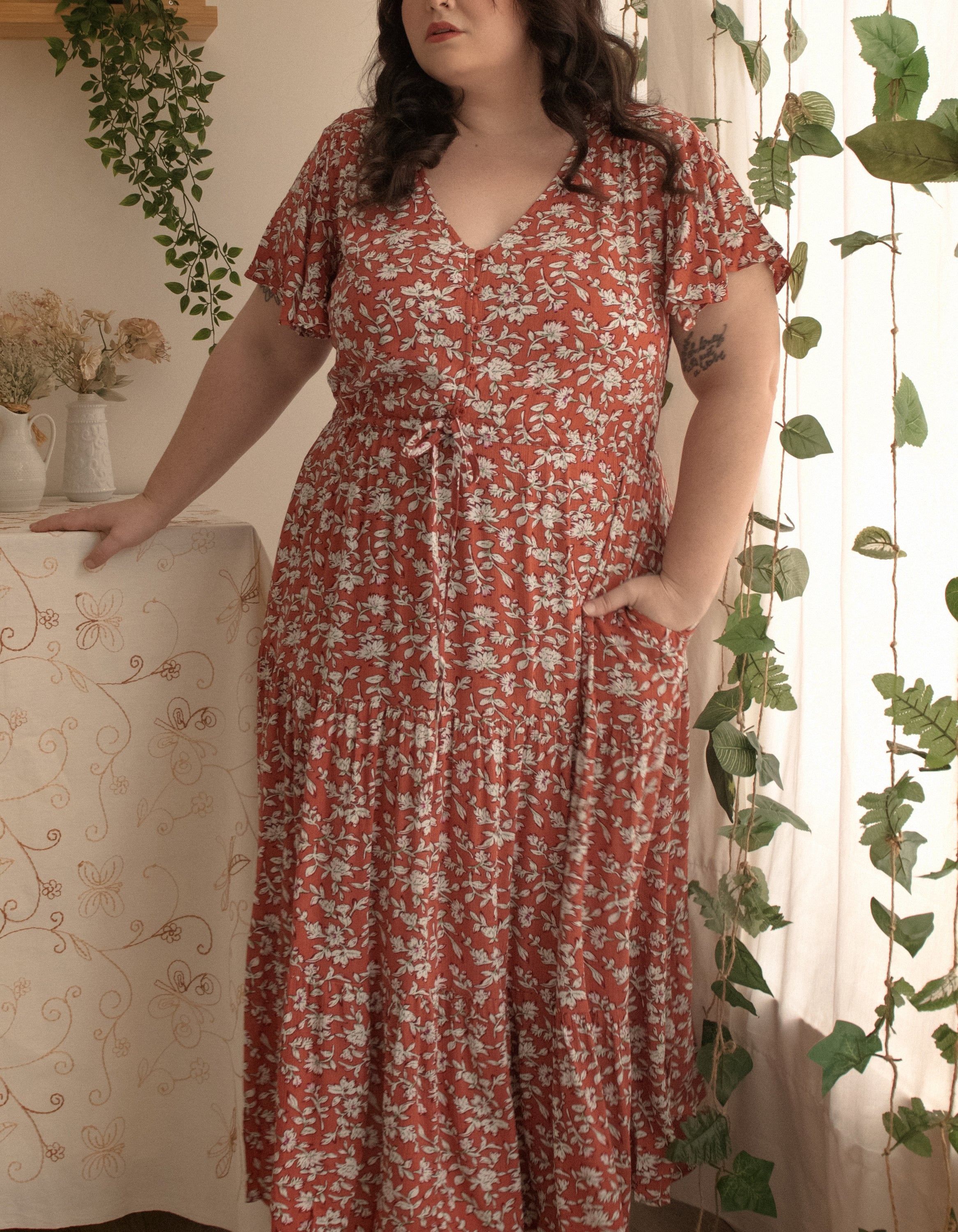 Lysandre Midi Dress in floral print rust with angel sleeves and tiered skirt, showcasing a stylish and comfortable design.