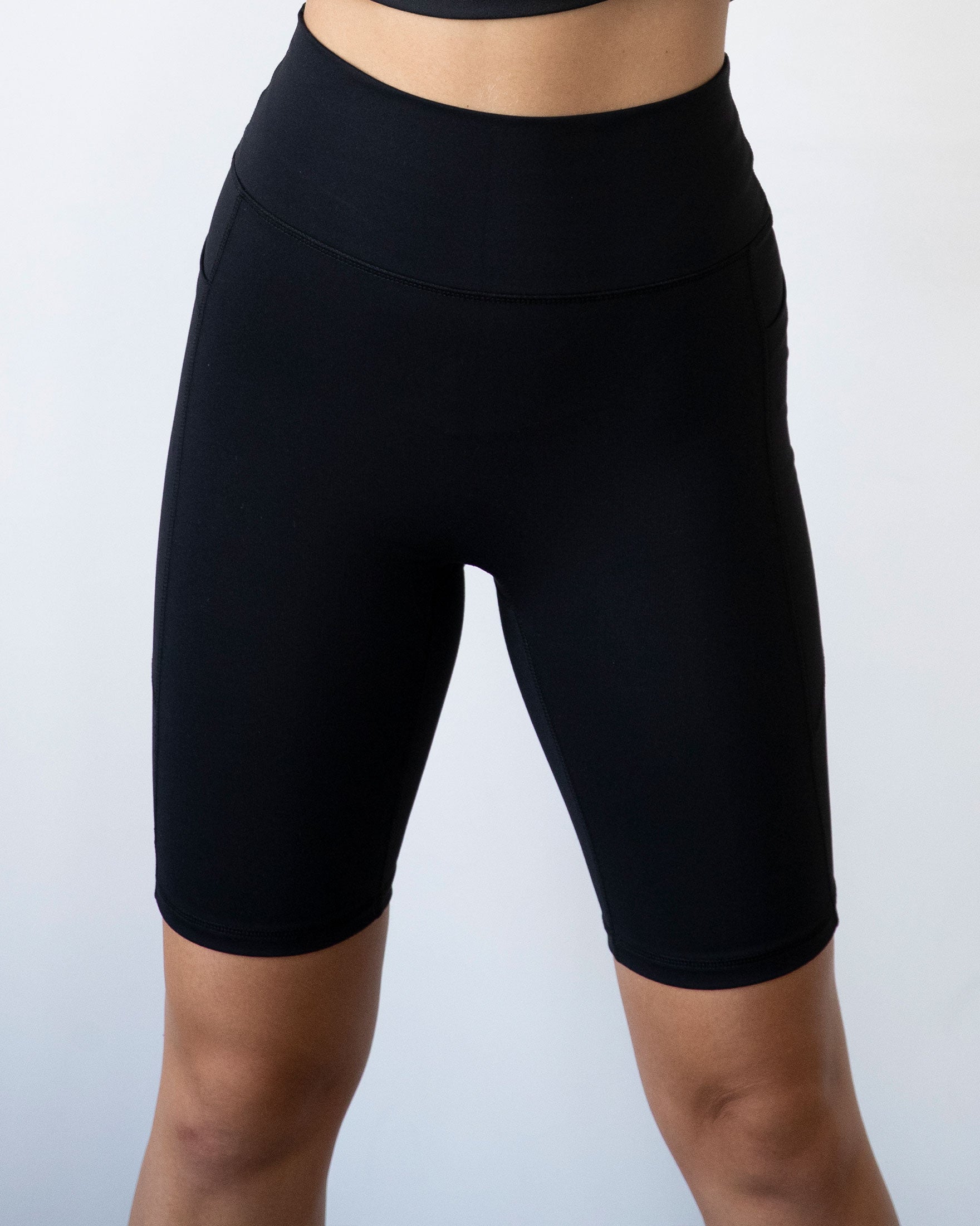 High-waisted Making Moves Pocket Biker Shorts in black, featuring a comfortable fit and side pockets, ideal for yoga and workouts.