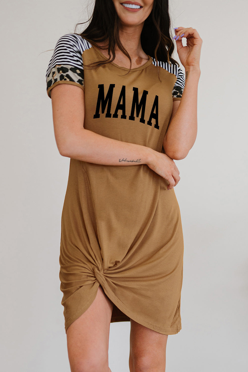 MAMA Graphic Round Neck Twisted Dress featuring a striped pattern and twisted neckline, perfect for casual outings.